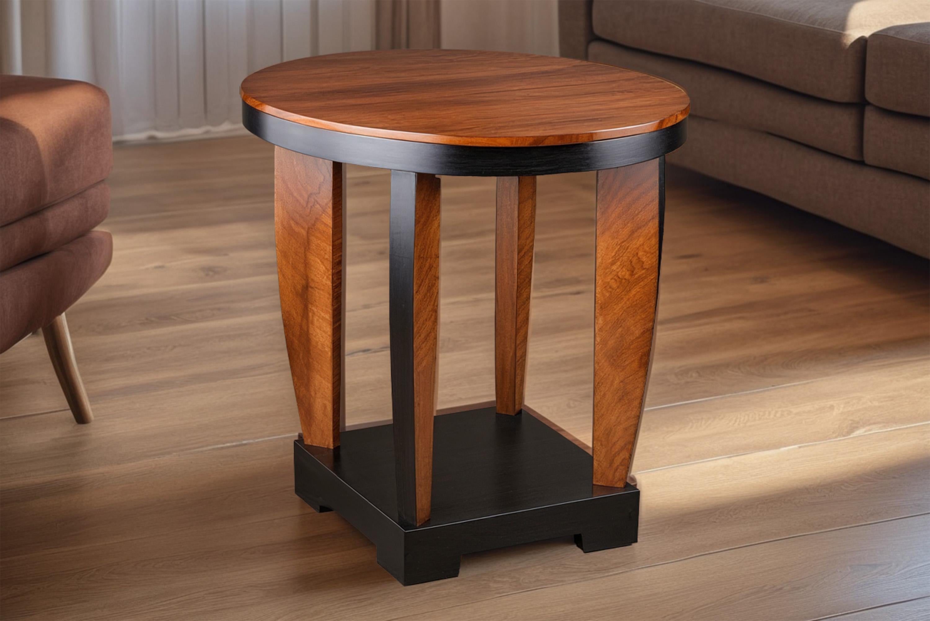 Beautiful round side table in Art Deco style with fine walnut veneer and an expressive veneer image. The curved legs and the angular lower level give the table a nice lightness. Thanks to the color contrast of the veneer and the black lacquer, the