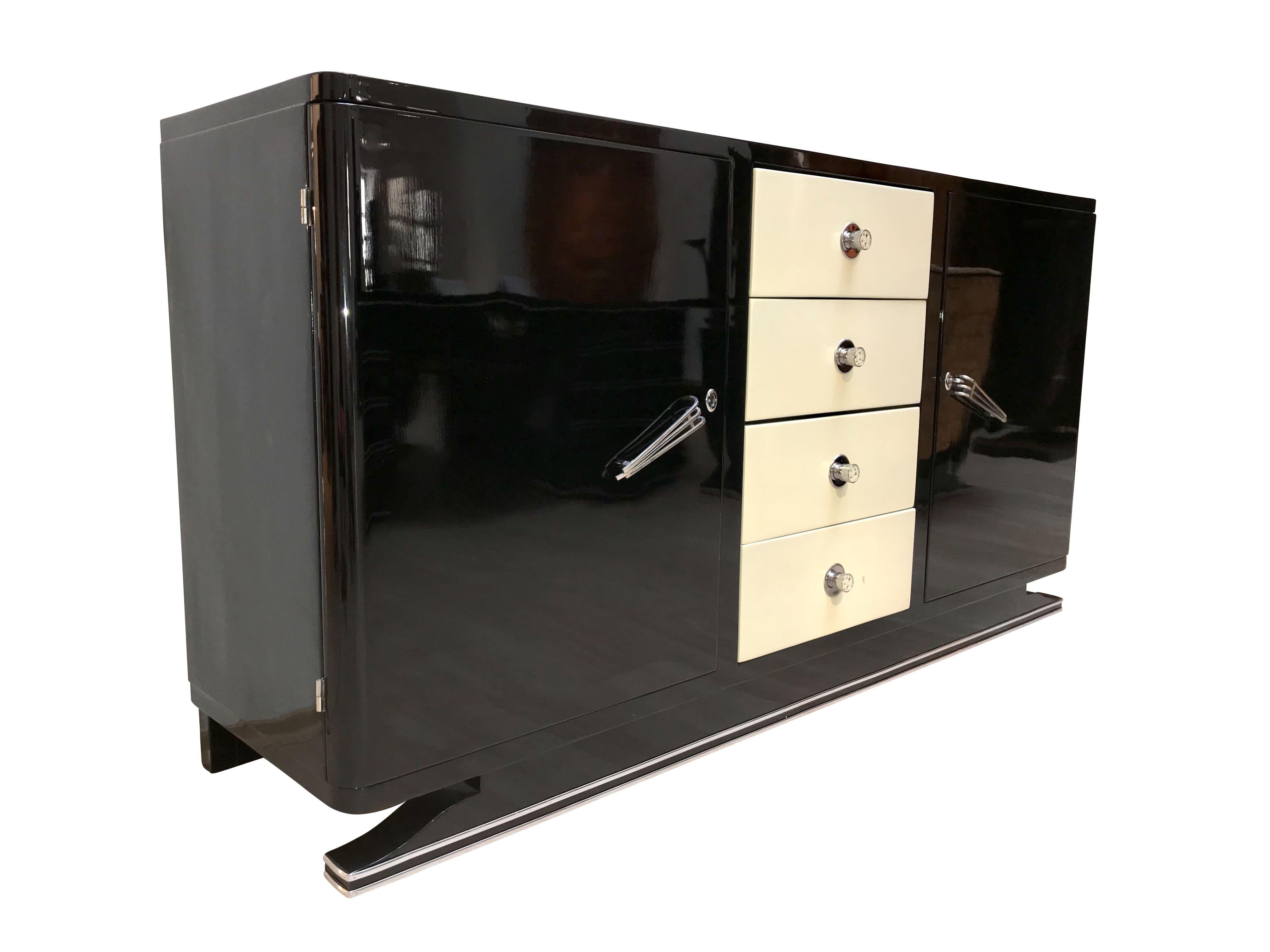 Wonderful, very classic and modern Art Deco Sideboard from France, circa 1930. 

Two black lacquered wood doors with very nice original chromed handles.

Four drawers lacquered in crème color with round chromed knobs for the drawers with white