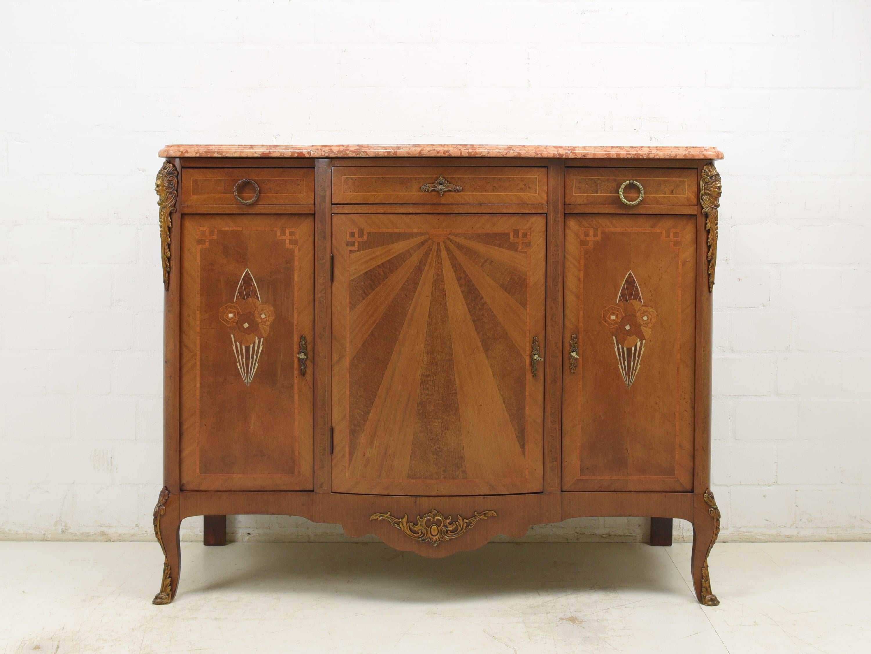 Dresser restored Art Deco circa 1925 mahogany sideboard chest of drawers

Features:
Three-door model with three drawers
Two continuous shelves
Very high quality processing
Drawers pronged
Original high-quality fittings and metal