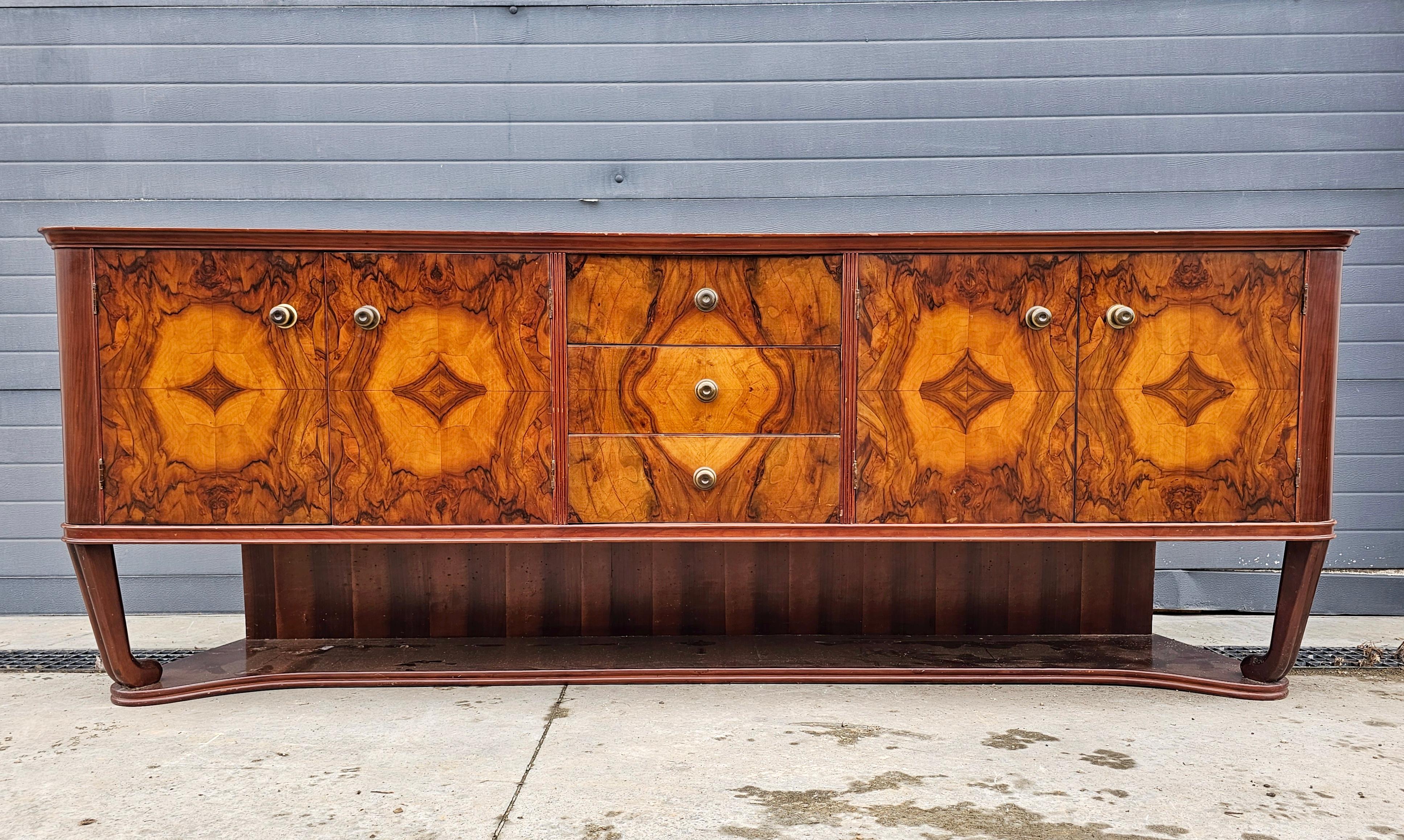 Italian Art Deco Sideboard done in burl walnut veneer with rich and dramatic grain For Sale