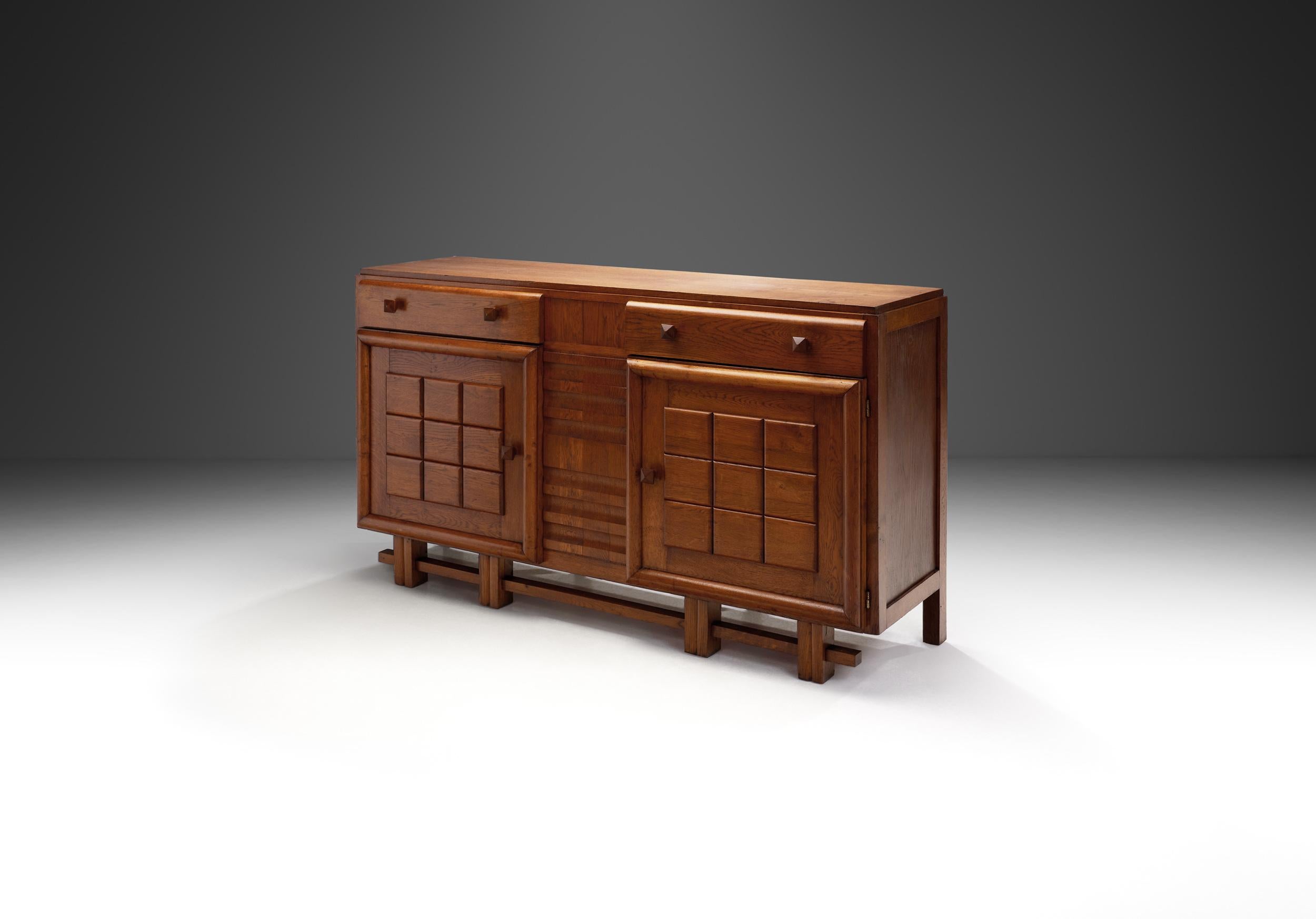 This unique sideboard was crafted during a period in the mid-20th century when design sensibilities shifted towards a blend of traditional craftsmanship and modernist principles. During the 1930s, Art Deco was highly prominent, with its eclectic,