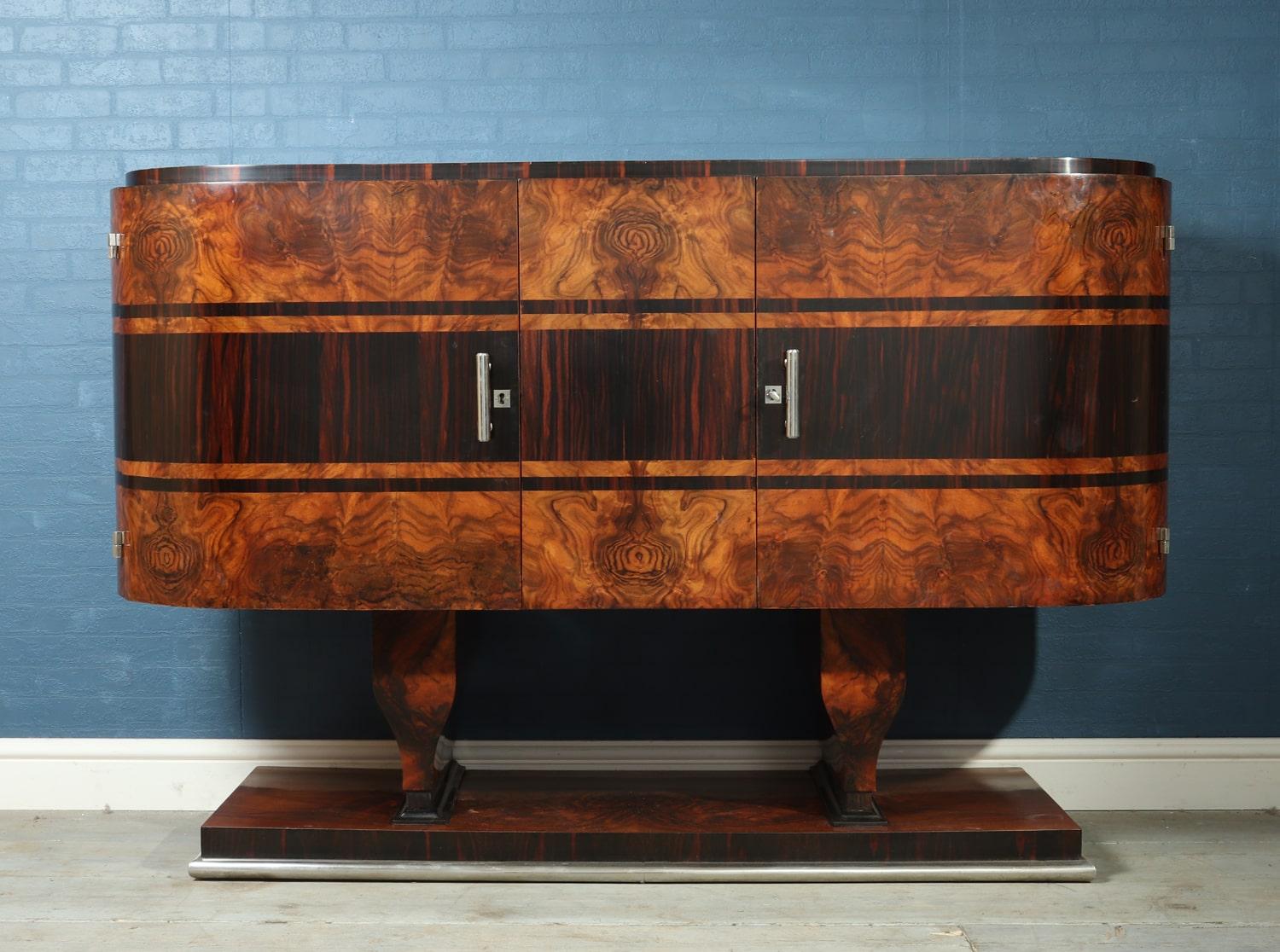 Art Deco sideboard in walnut and Macassar, circa 1930
A stunning cigar end art deco sideboard produced in Italy in the 1930s in walnut with Macassar cross banding and inlay, chromed hard wear, locks working with keys fully restored and polished and