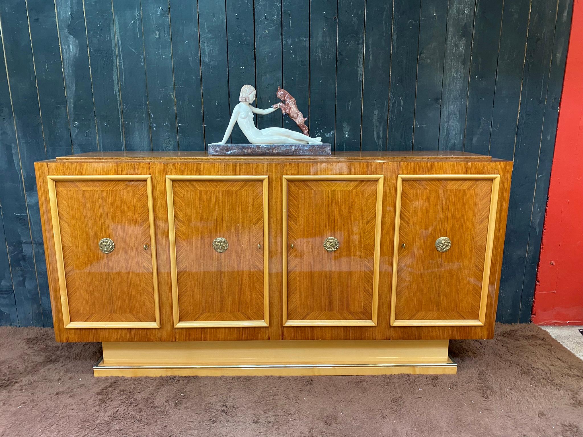 Art Deco Sideboard in Walnut and Sycamore circa 1930
4 pretty bronze medallions
very beautiful sycamore interior
good condition, restored 3 years ago
all small defects of use
  