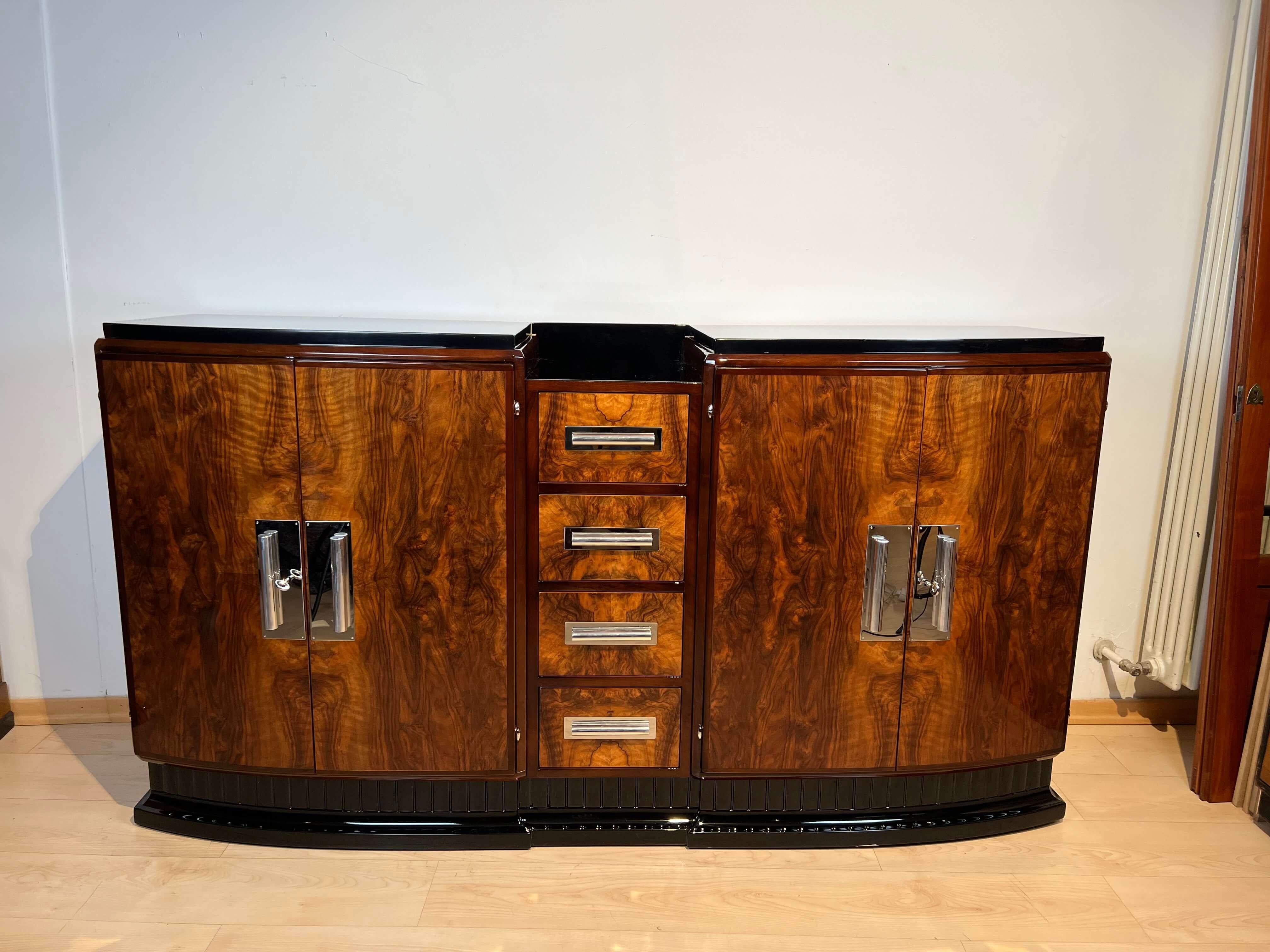 Art Deco Sideboard, Walnut Veneer and Black Lacquer, France circa 1930

Two doors and four drawers. Walnut veneered and solid, partly ebonized. Gorgeous veneer on the drawers and doors. Lacquered high gloss surface.
Above with black lacquered wooden