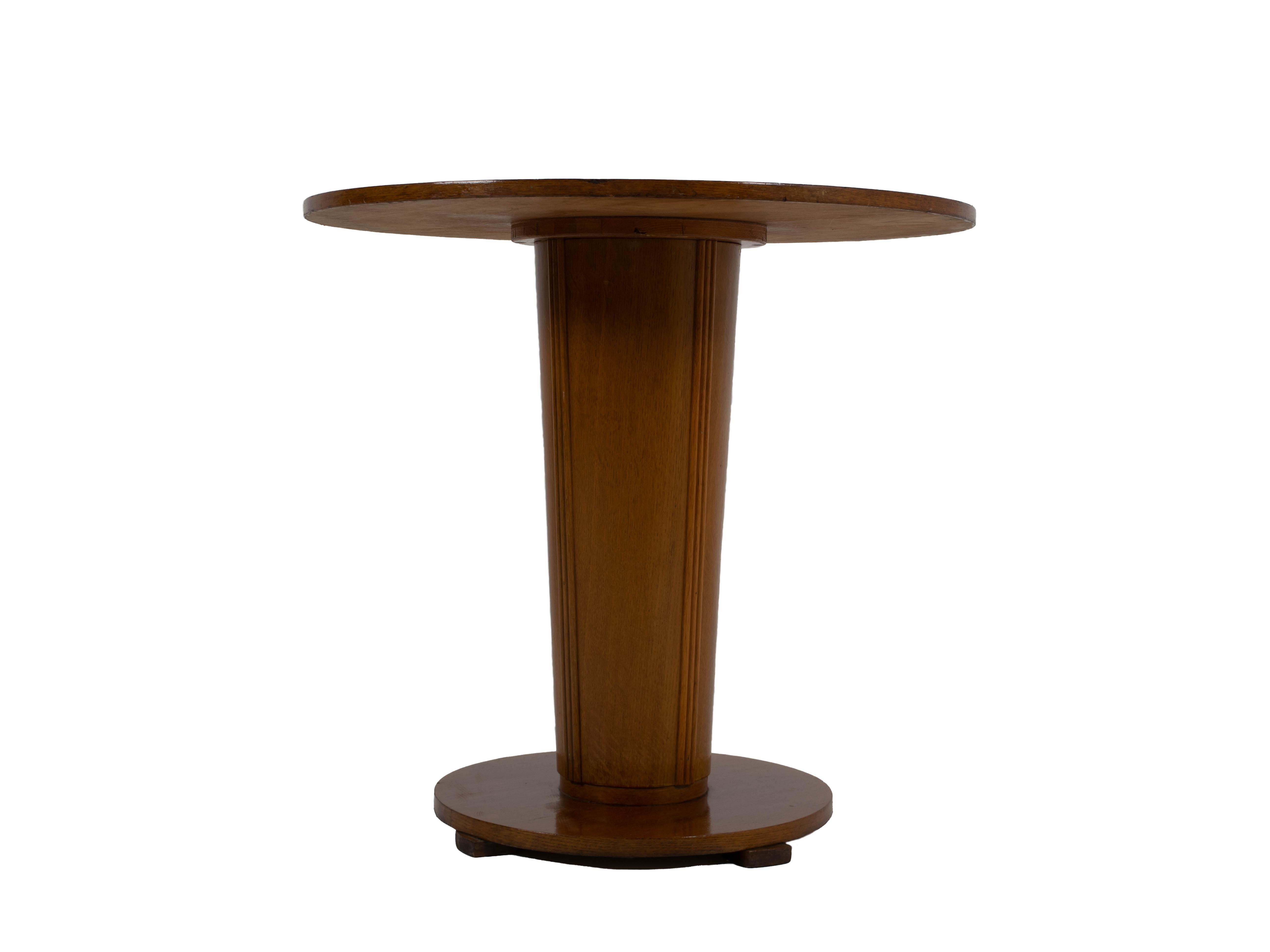 Nice Art Deco sidetable from The Netherlands 1930s. This table has a sleek round design with a nice detailed base. The table is in good condition and the wood has a layer of lacquer on it, giving it a gloss.