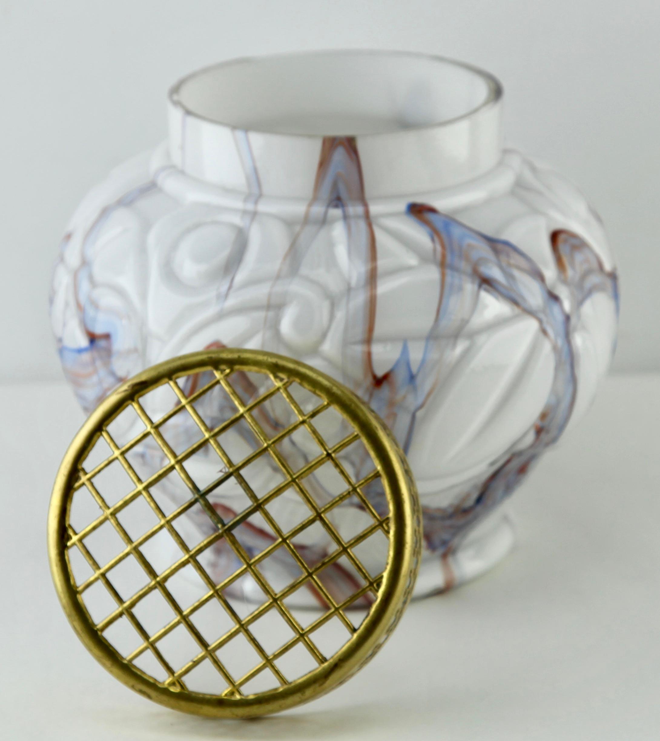 The Roses plugs were a great commercial success.

Documentation can be found in the book of Les Verreries de Scailmont
a l epoque Art Deco. To view on last picture.

These glass pieces made in Belgium during the Art Deco period have some shapes and