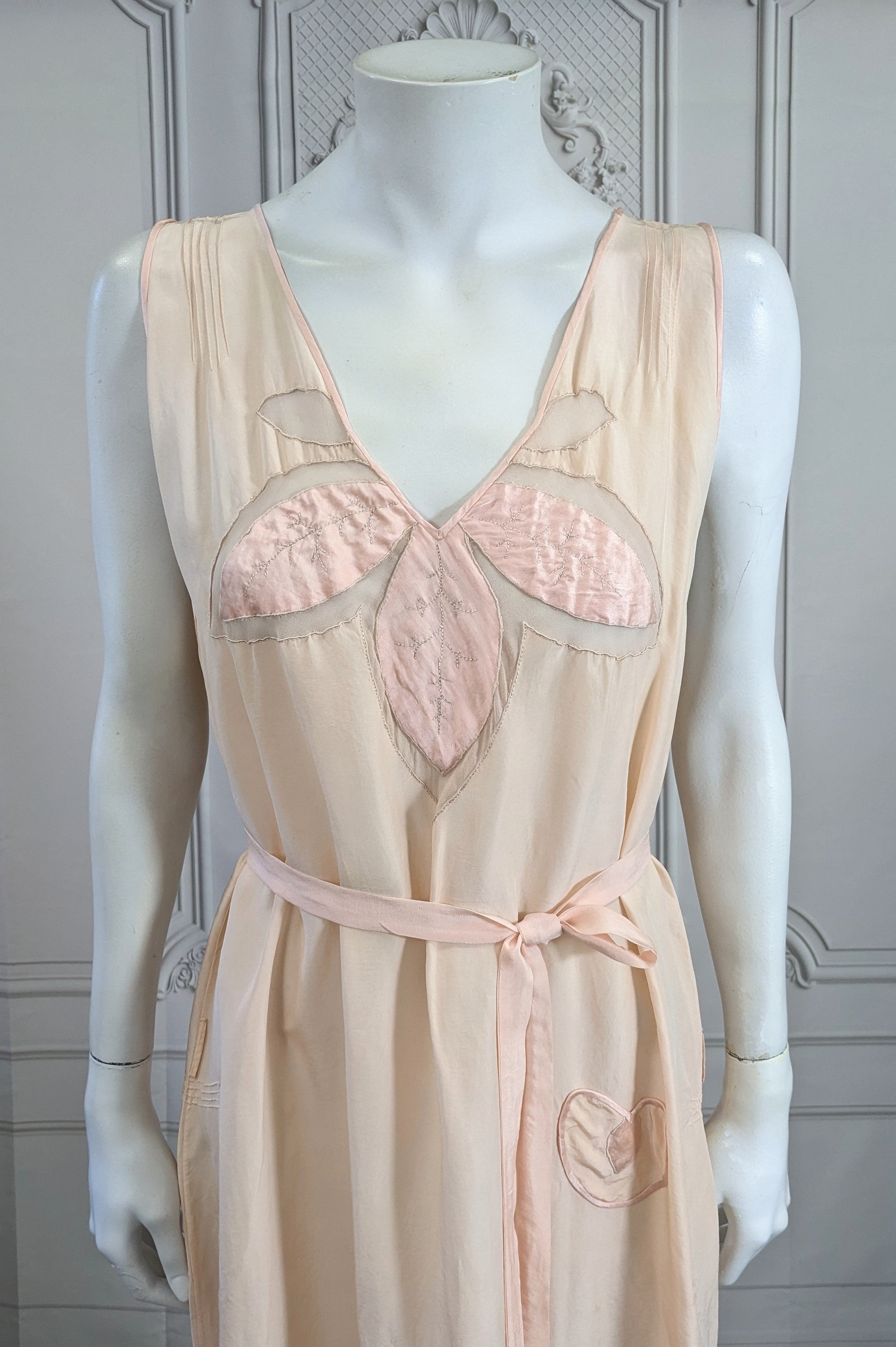 Art Deco Silk and Chiffon Slip Dress with easy fit and self belt. Easy slip over styling with deep armholes and large straight cut. A floral silk satin motif is hand embroidered with chiffon sheer inserts on bodice with heart shaped pocket. Great