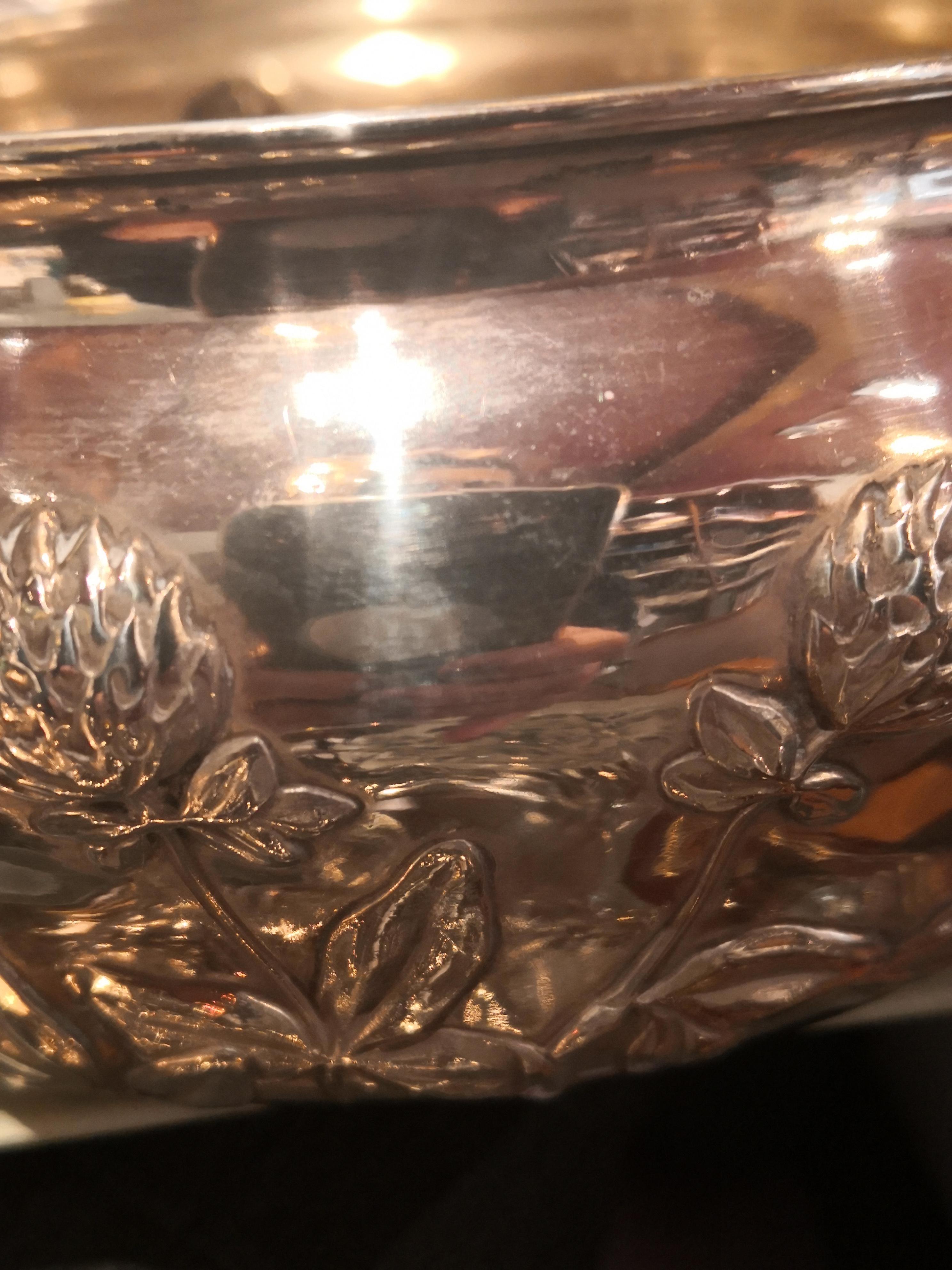 Art Deco silver bowl in silver with a naturalistic formed garland of dandelion blossoms and leaves. Stamped with the Danish hallmarks and the Danish crowne. Backside stamped silver and S&M Benzen for Sophie and Mathilde Benzen. Benzen was a former