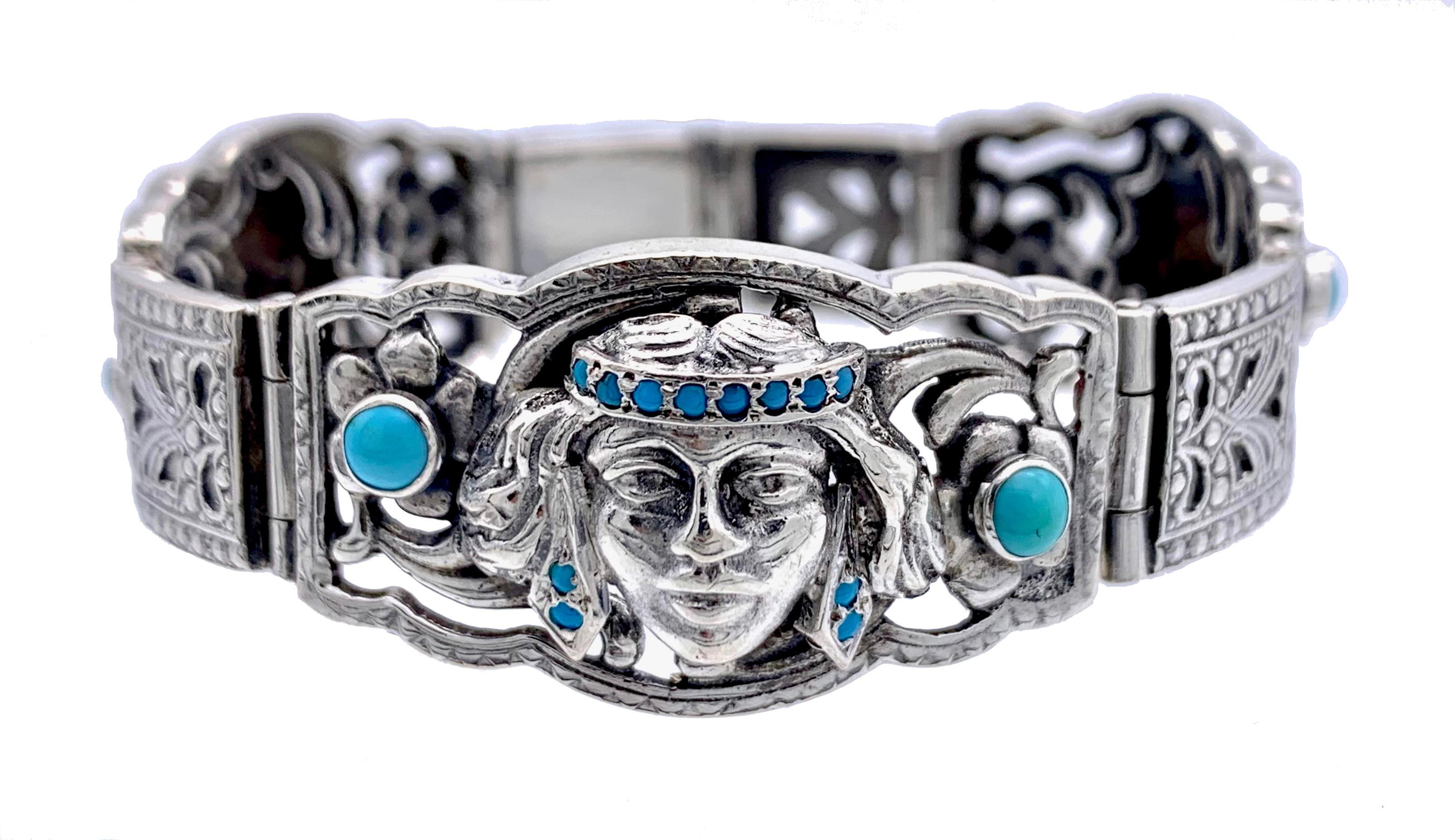 Extravagant and highly unusual Austrian Art Deco hinged silver bracelet fully hallmarked with Austrian silver marks, maker's initials KT and letter P.
Three panels show finely modelled heads of Native Americans wearing turquoise set headdresses and