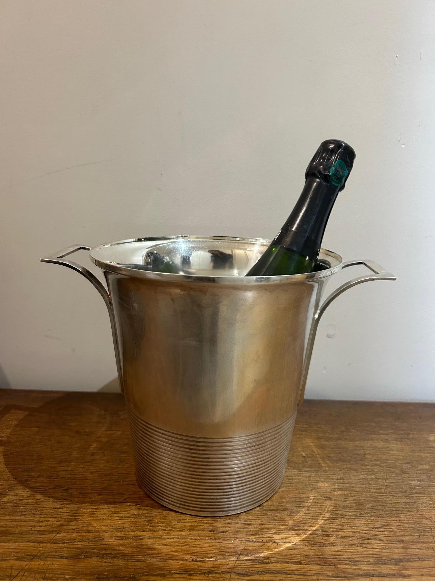 modernist champagne bucket in silver from the art deco period in good condition 
stamped with rooster 