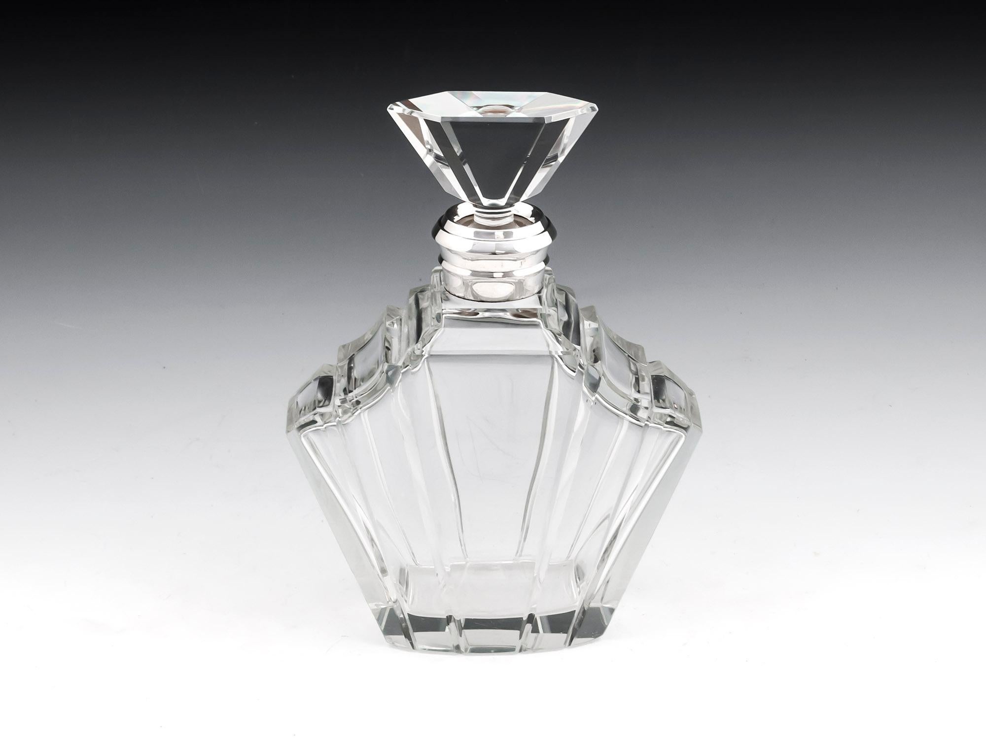 Art Deco single uniquely shaped silver collared decanter. Hallmarked Birmingham silversmiths “Adie Brothers Ltd” 

This decanter is very heavy and of the highest quality in A1 condition.
