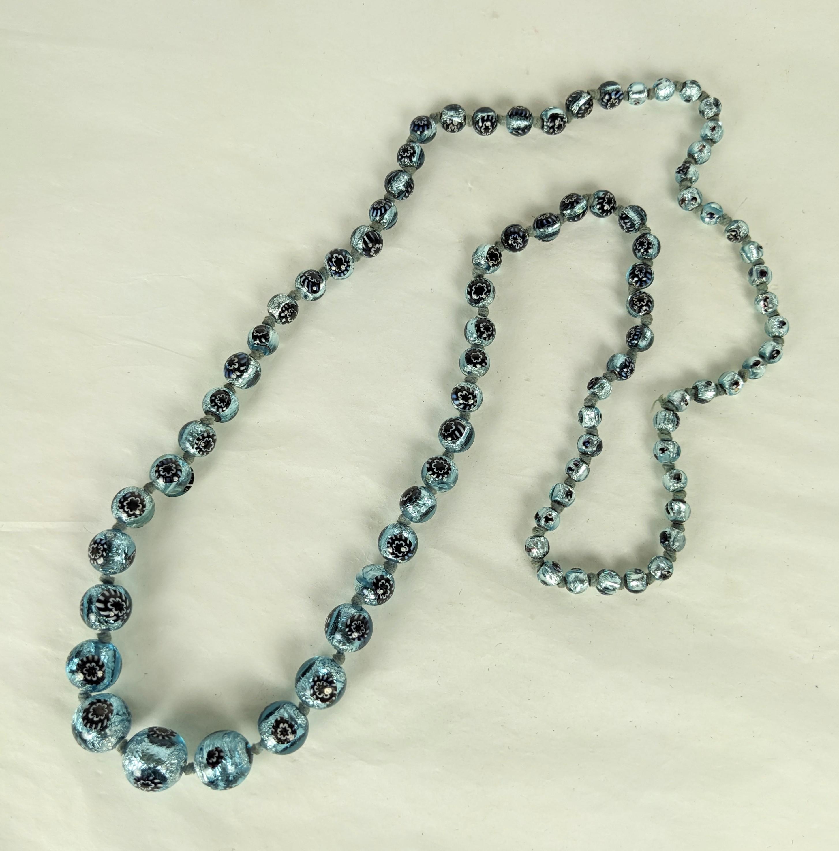 Art Deco Silver Foiled Murano Beads from the 1930's. Graduated and handmade with silvered foil within aquamarine glass and floral murrine. Handmade and hand knotted, lovely quality.  30