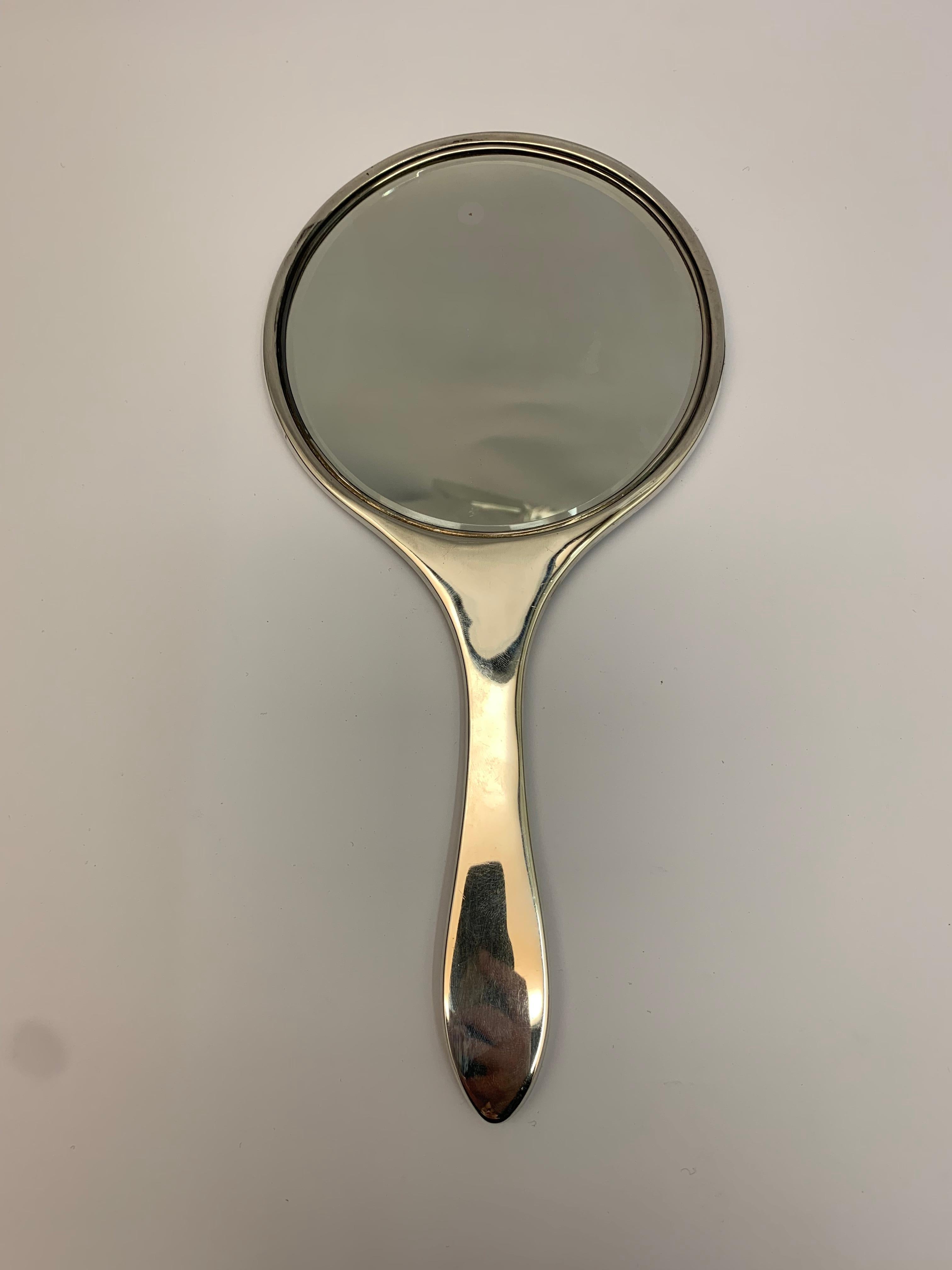 A large Art Deco antique silver hand mirror, made in Birmingham in 1922.