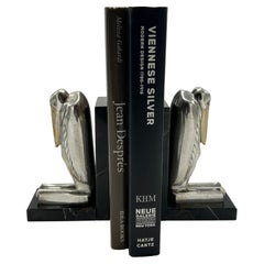 Sujetalibros de metal marabú plateado Art Déco