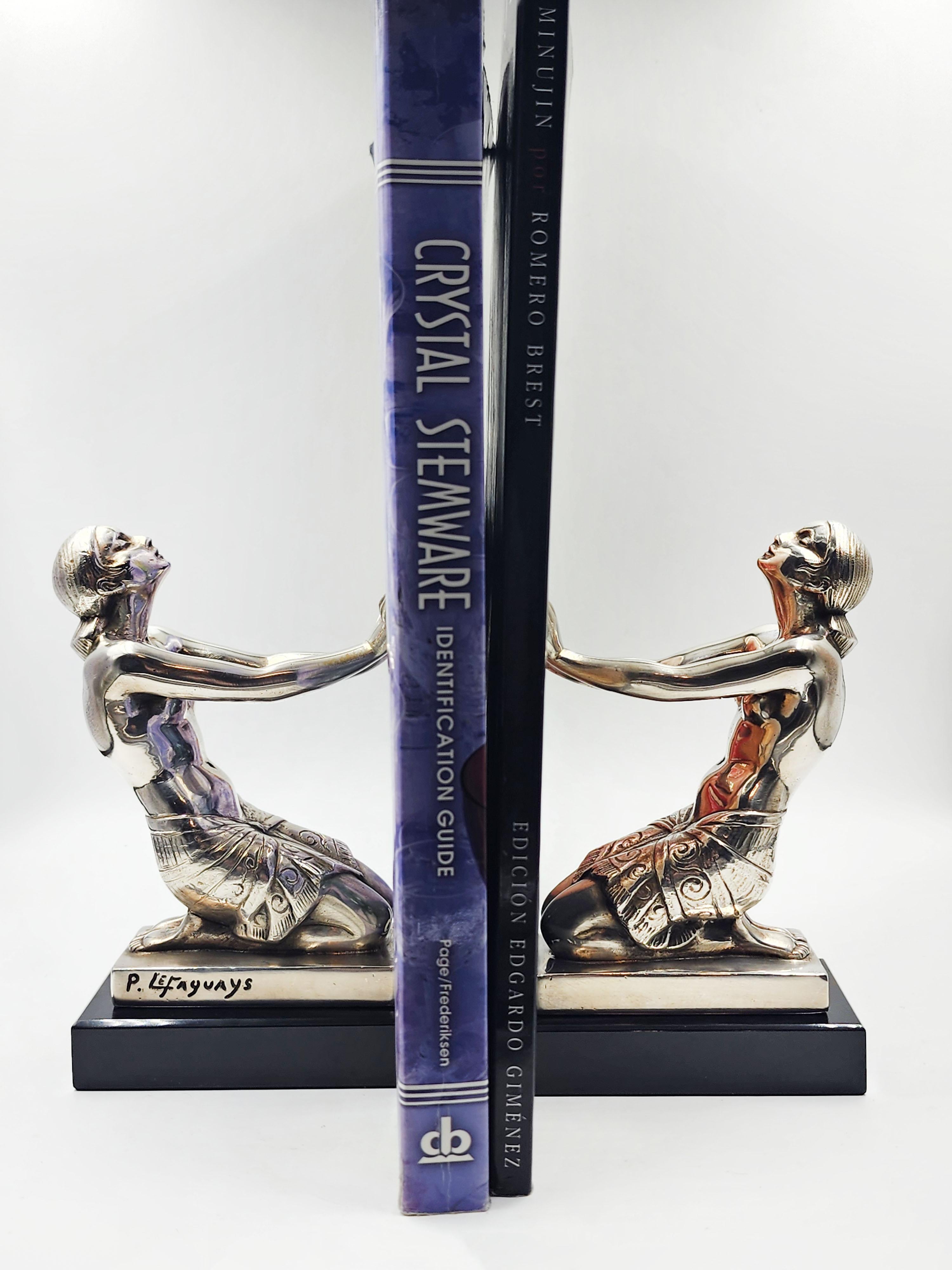 French Art Deco silver metal bookends by Pierre Le Faguays For Sale