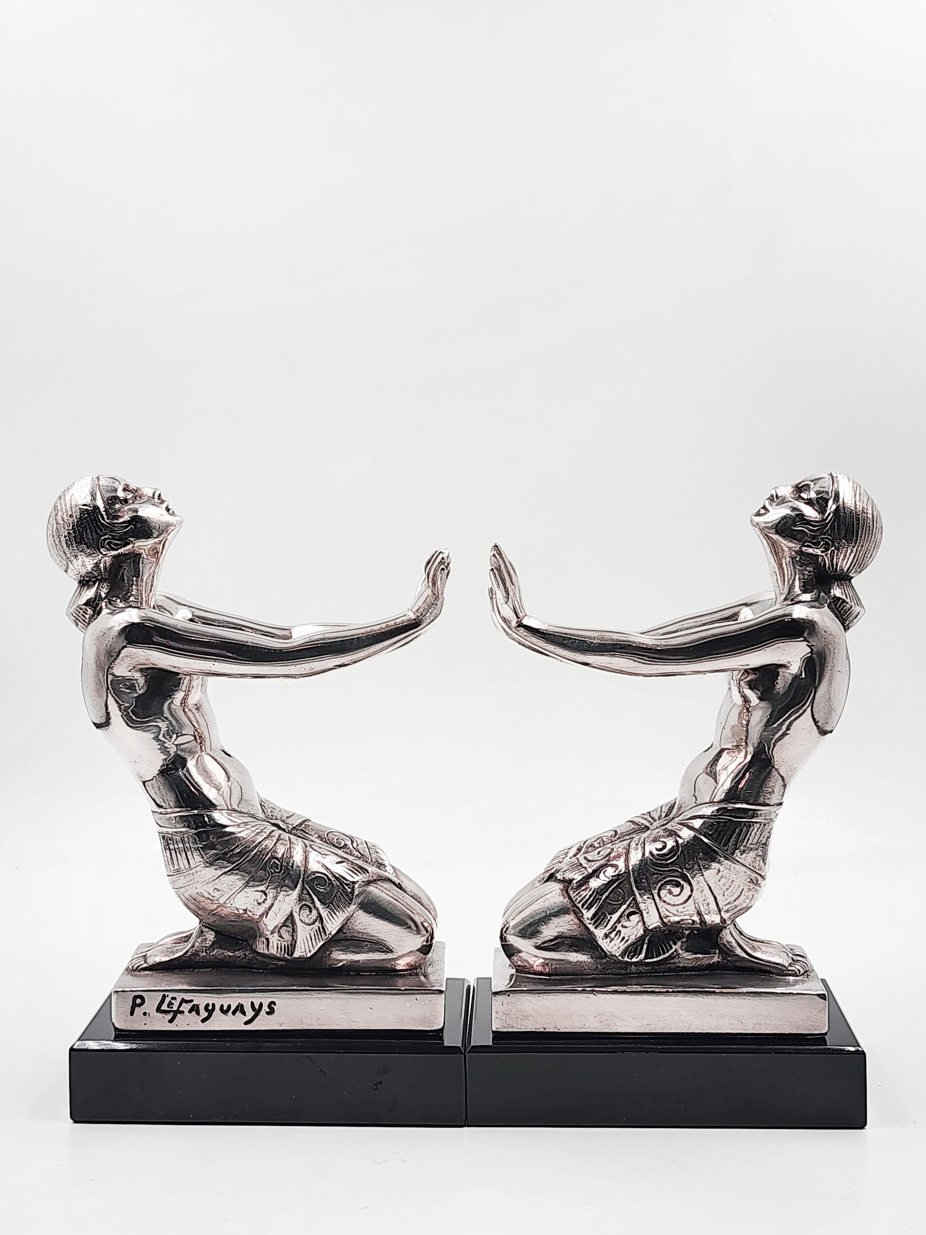 Hand-Crafted Art Deco silver metal bookends by Pierre Le Faguays For Sale