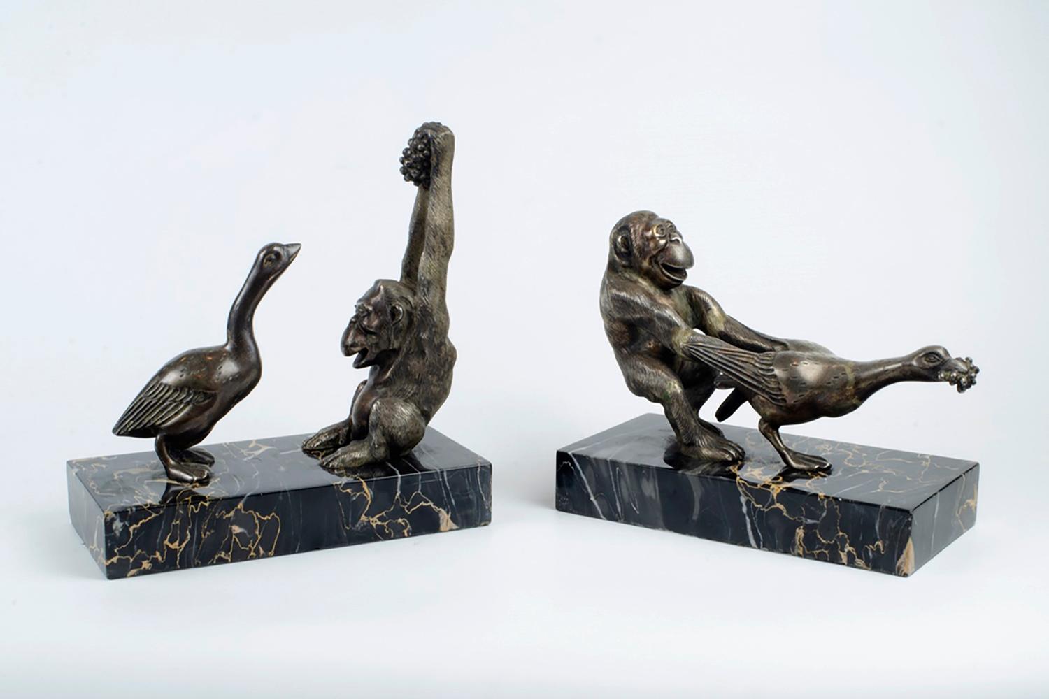 French Art Deco Silver on Bronze Chimp Pulling Goose Statuette by G.H. Bourcart For Sale