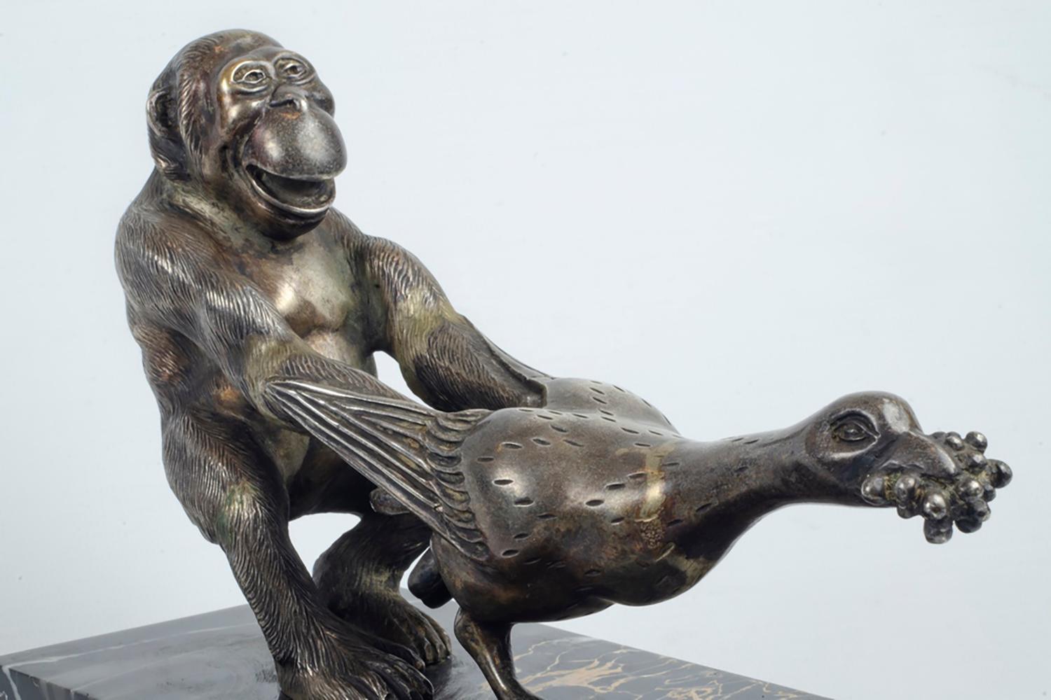 Early 20th Century Art Deco Silver on Bronze Chimp Pulling Goose Statuette by G.H. Bourcart For Sale