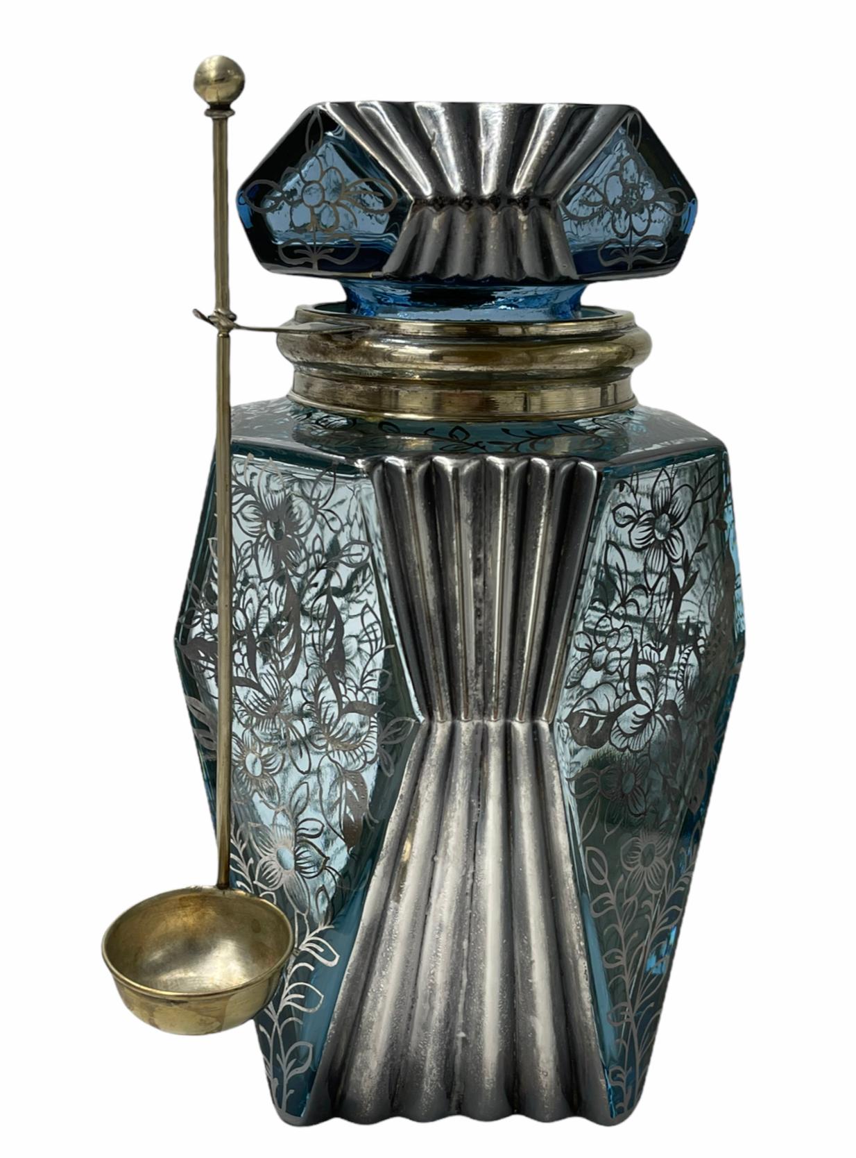 Beautiful Art Deco decanter set in great condition. Would look excellent with a bar set as decoration or for use. Very rare to find such a complete set in such great condition. Comprised of a blue glass olive jar with with a silver plated collar and