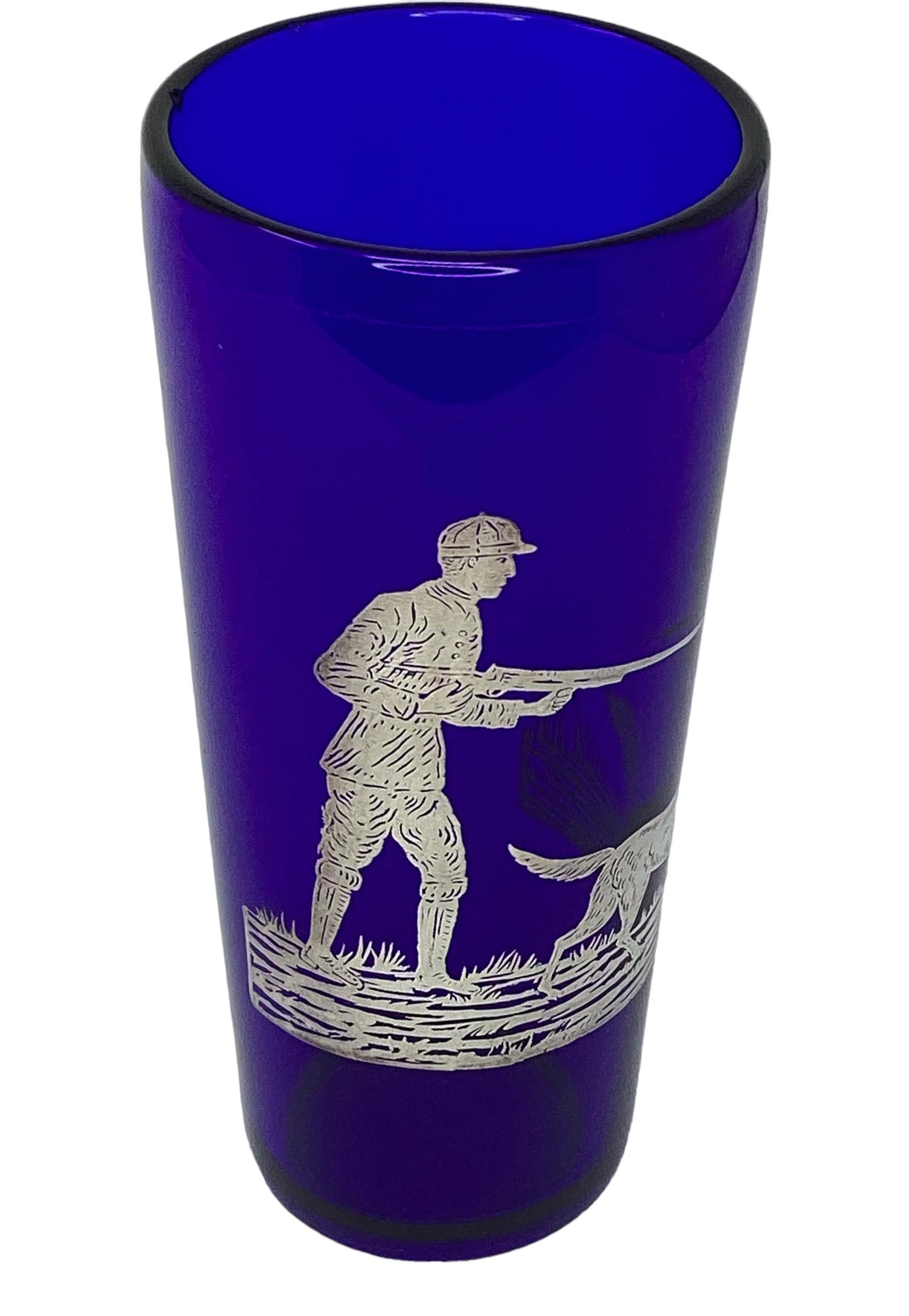 Art Deco Silver Overlay Cobalt Blue Cocktail Shaker. Beautifully decorated with a figure of a hunter and his trusted dog hunting.