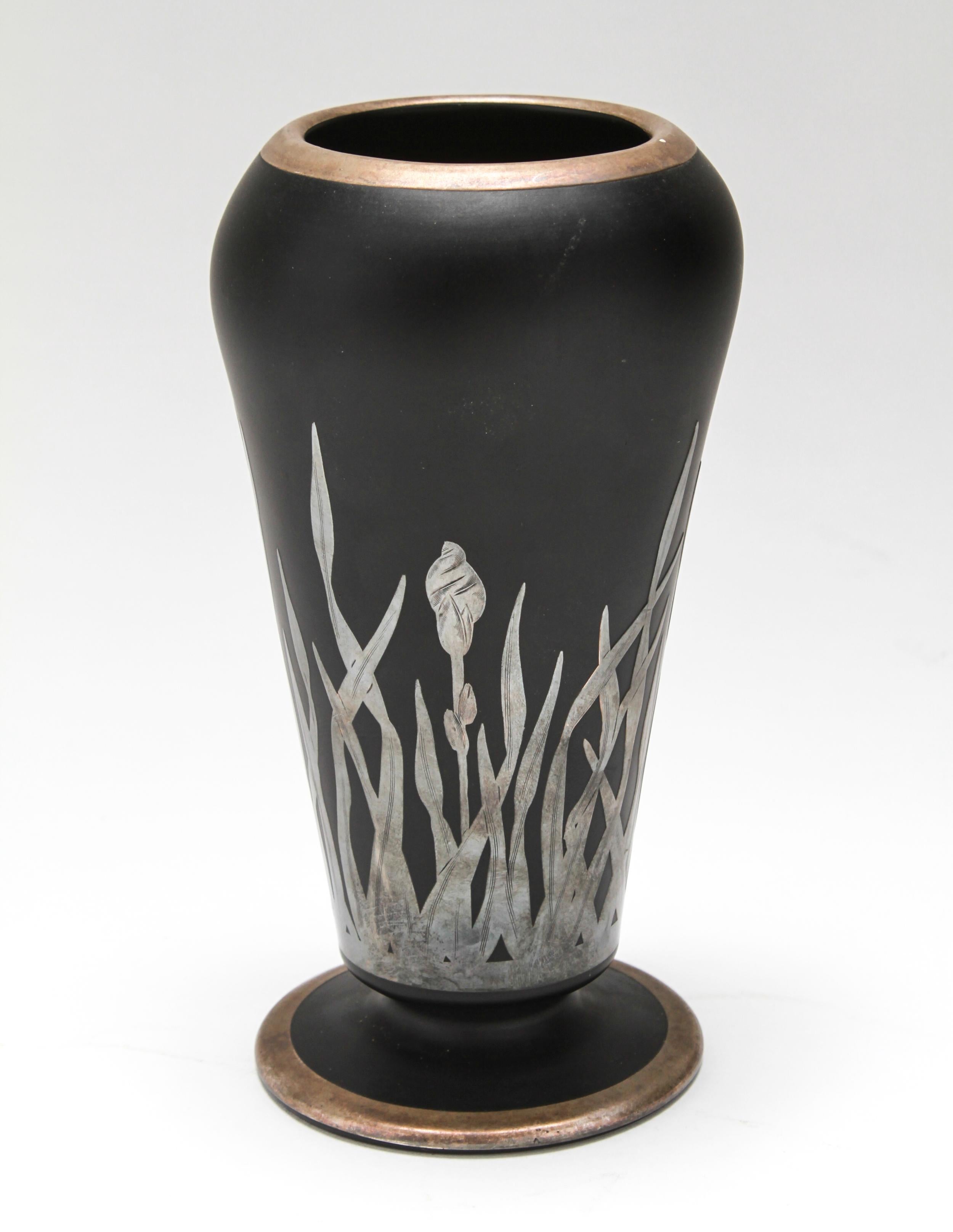 Art Deco period glass vase in satin black glass with silver iris motif overlay, circa 1920. Attributed to Rockwell. The piece is in great vintage condition.