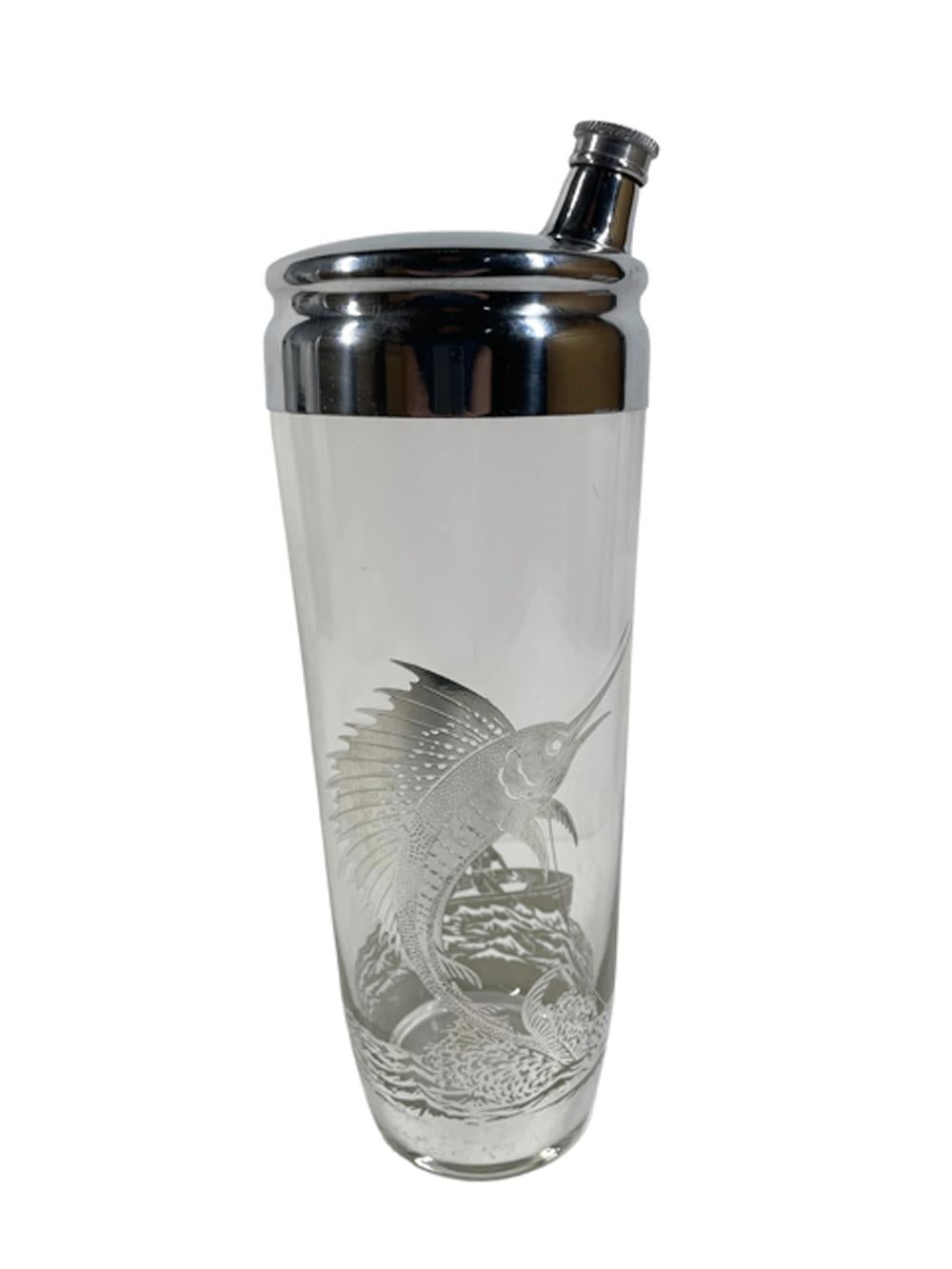 Art Deco silver overlay cocktail shaker and 6 double old fashioned glasses. The shaker and glasses all decorated in sterling overlay with a leaping sailfish / marlin on the front and two men fishing from a dory on the back, all connected by a wavey