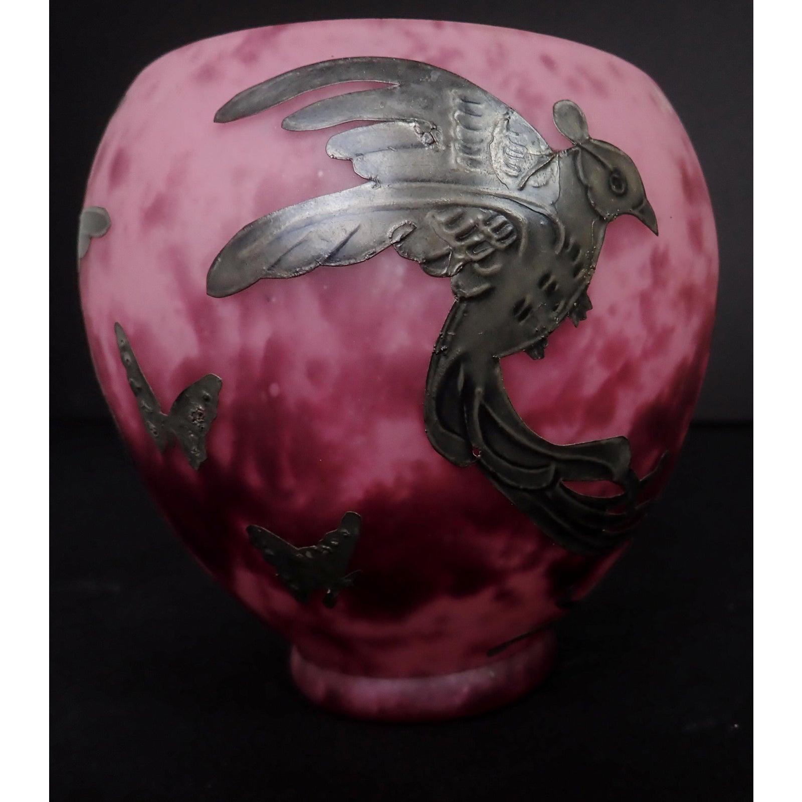 Art Deco mottled purple art glass vase with applied silver overlay birds.
Features silver overlay birds and butterflies.