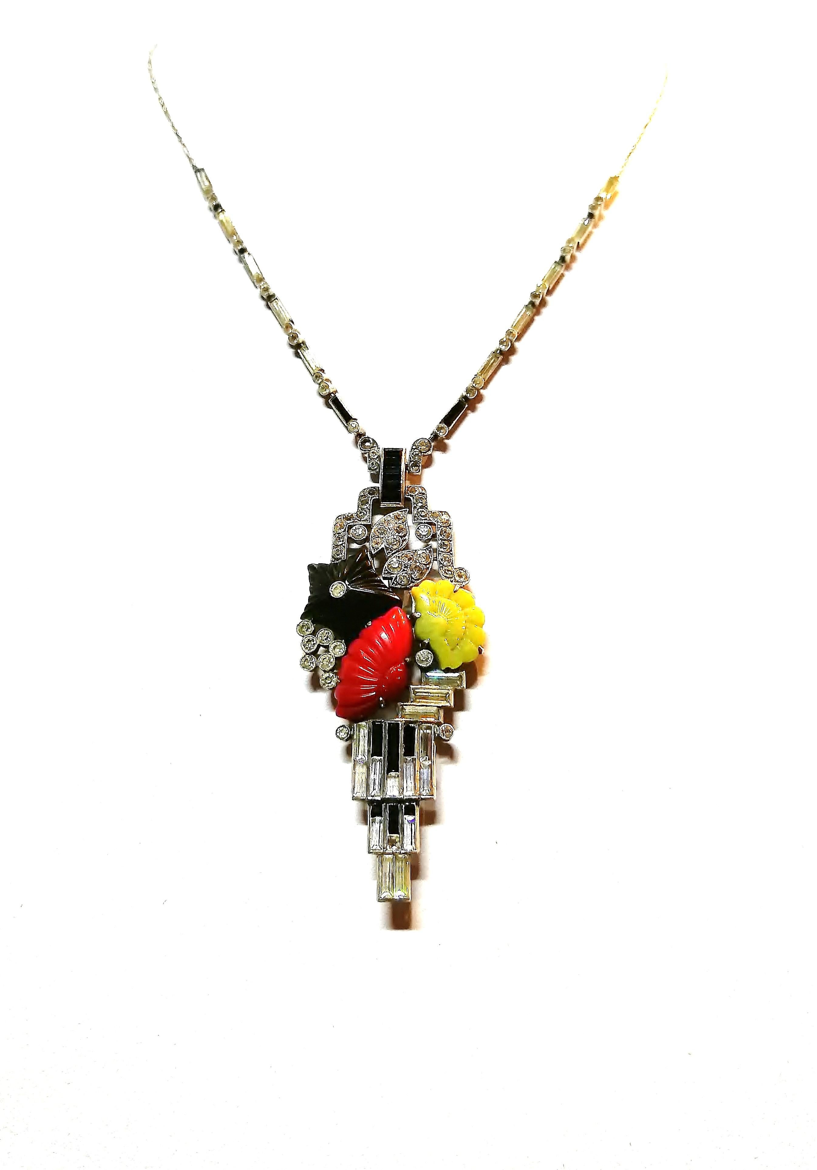An exquisite and exceptional Art Deco silver and paste stylised pendant necklace made by Knoll and Predgizer, of Pforzheim, Germany in the 1920s. Very much in Art Deco  style, the sautoir contains three carved pieces of coloured glass, all in
