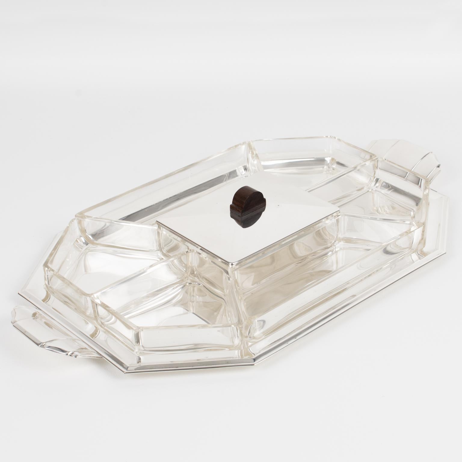 Silversmith Quist designed this exquisite Art Deco barware service for cocktails or appetizers. The piece was crafted circa 1930. The modernist bar accessory features a large silver plate hexagonal serving tray with carved handles. Six blown crystal