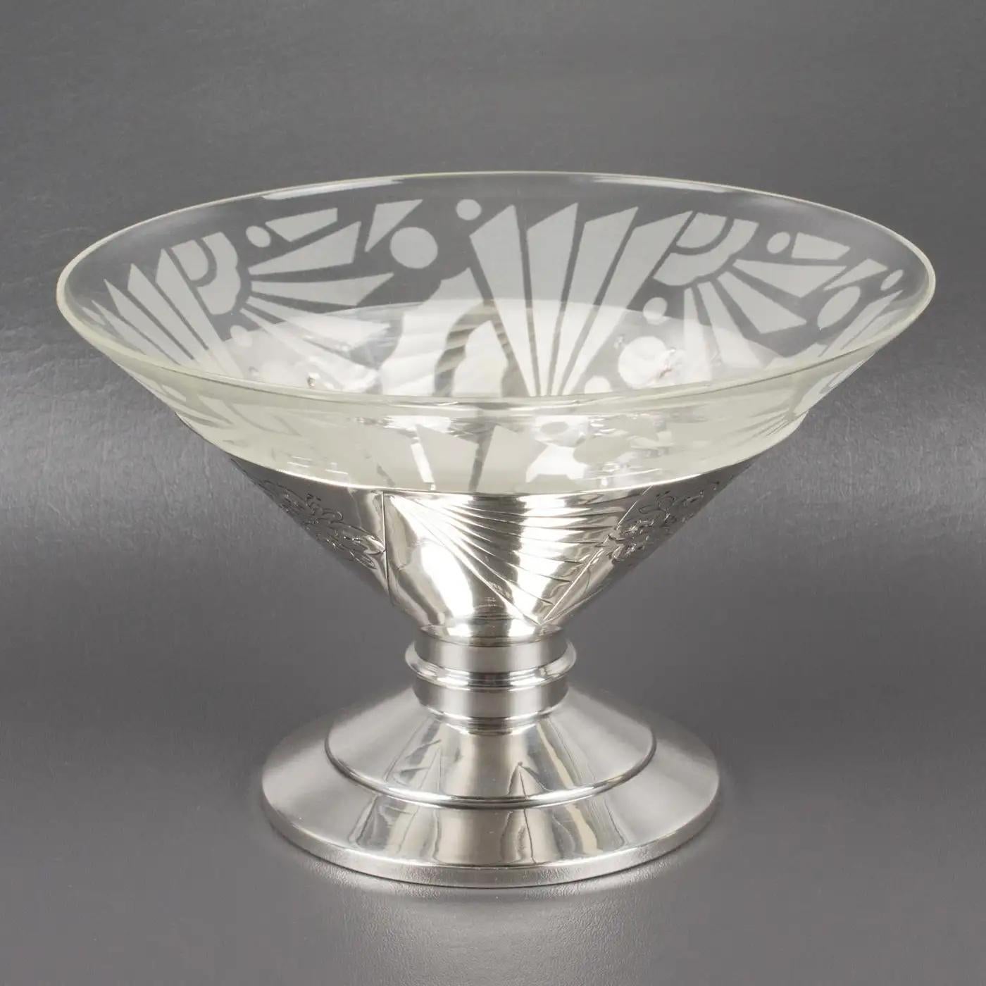 French silversmith SFAM, Paris (Société Francaise d'Alliages et de Métaux) designed this stunning Art Deco centerpiece or serving bowl. The tall pedestal shape is silver-plated metal with stylized floral and geometric embossed design. The insert