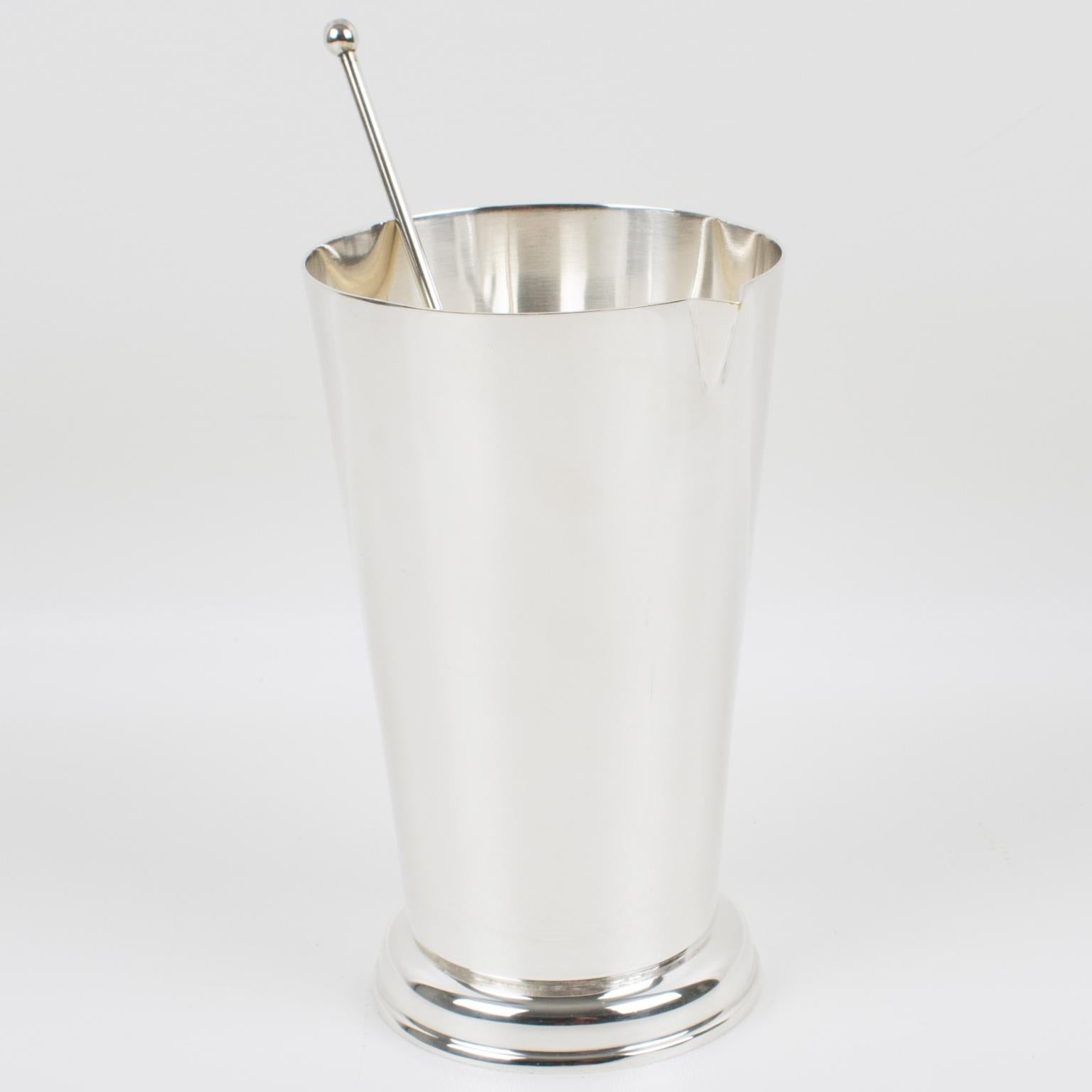 A streamlined Art Deco barware set designed by French silversmith Produx, Paris. Sleek and modernist shape with tall silver plate Martini pitcher or mixer jug and long stirrer spoon. Marked underside with legal silversmith hallmarks.
Measurements: