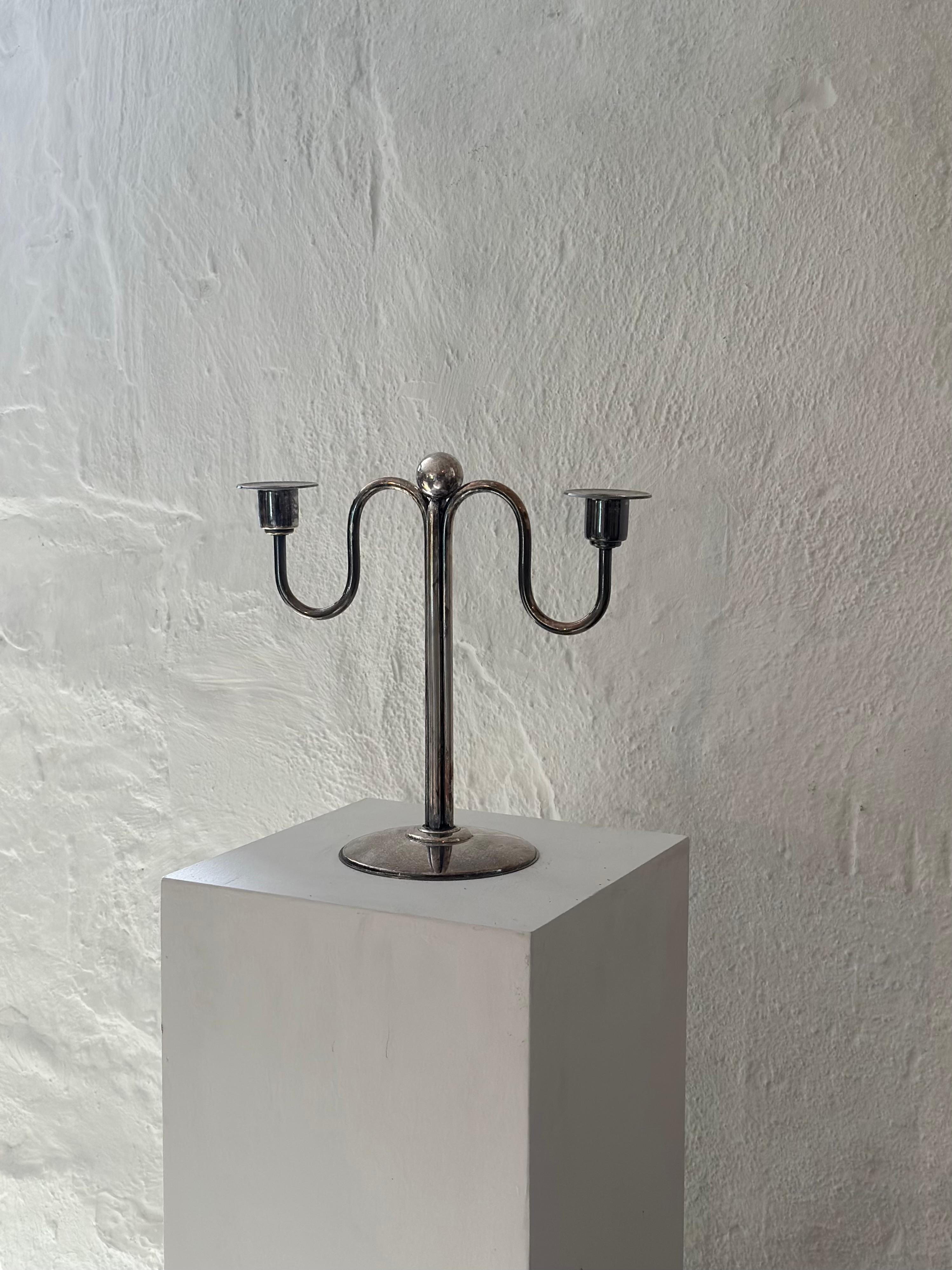 Rare art deco silver plate candleholder by Quist, Württemberg 1930s-1940s, Germany. Beautiful design in good condition. Signed underneath with Quist, Württemberg.

The distinctive silver maker’s mark bears a star and the name Quist which represents