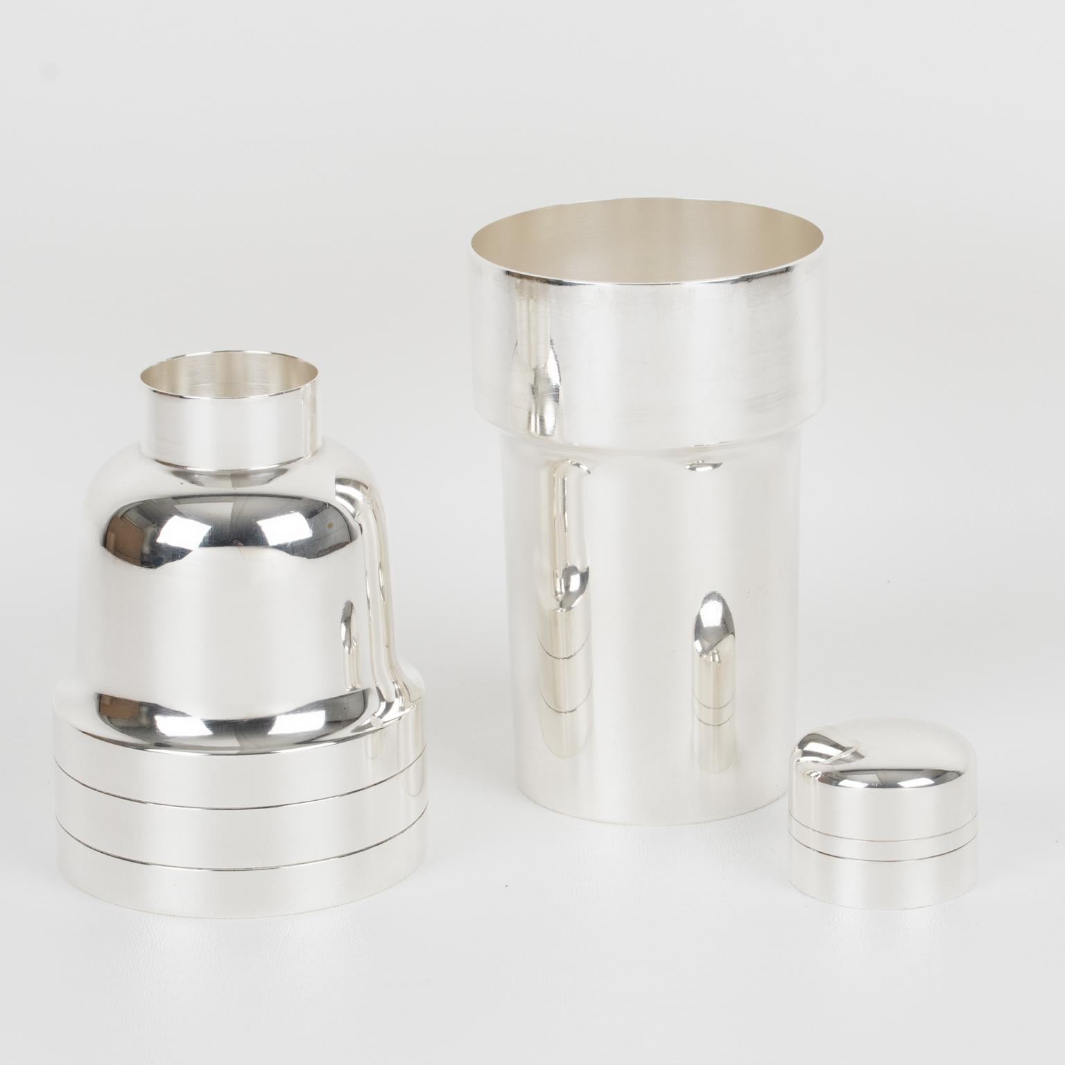 Silversmith CGF, Lyon, France, designed this lovely Art Deco silver plate cylindrical cocktail or Martini shaker. The three-sectioned cocktail shaker has a removable cap and filter strainer. The bar accessory boasts an Art Deco flair with a