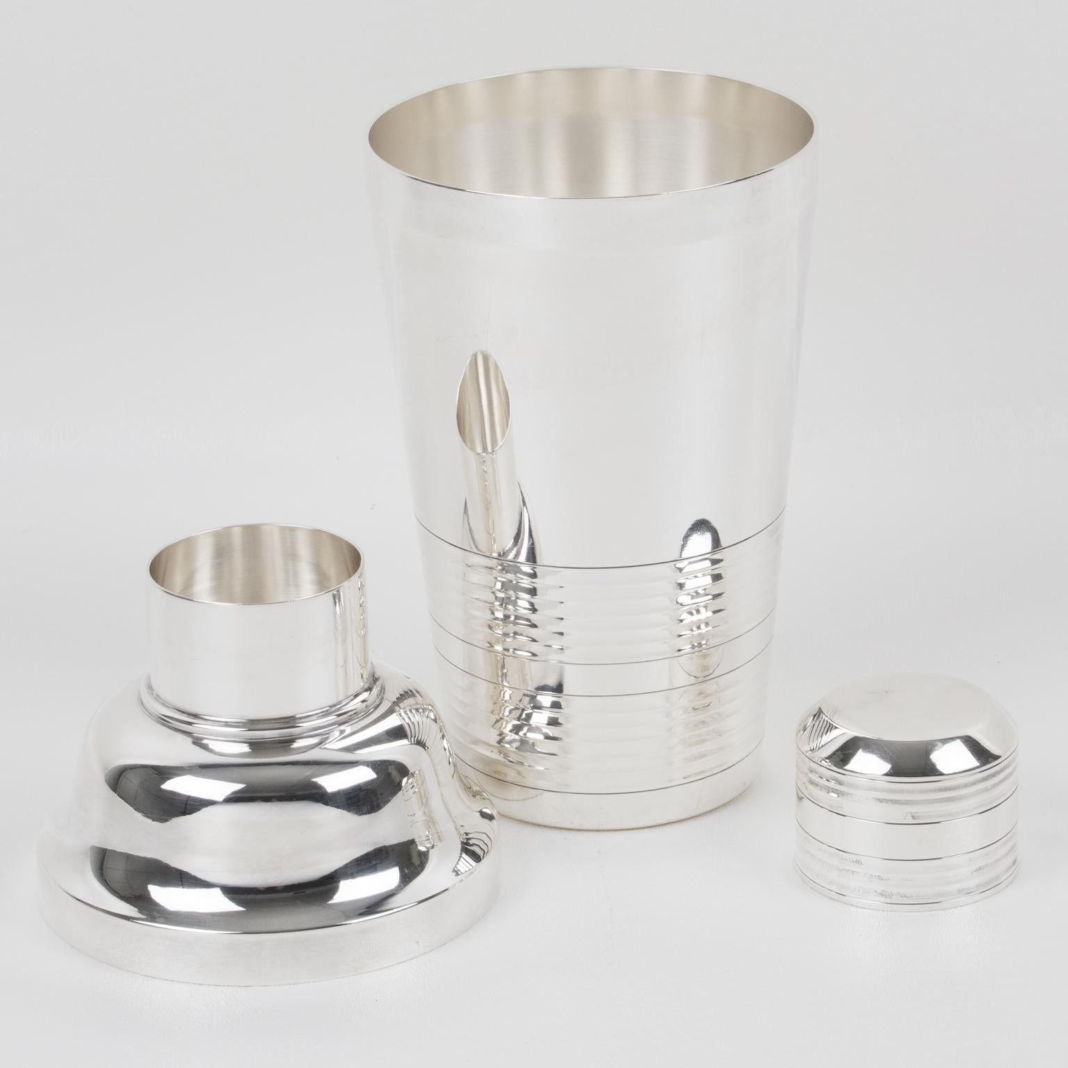 Elegant French Art Deco silver plate cylindrical cocktail or Martini shaker by silversmith Dixi, Paris. Three-sectioned designed cocktail shaker with removable cap and strainer. Lovely geometric shape with typical Deco design. Marked underside with