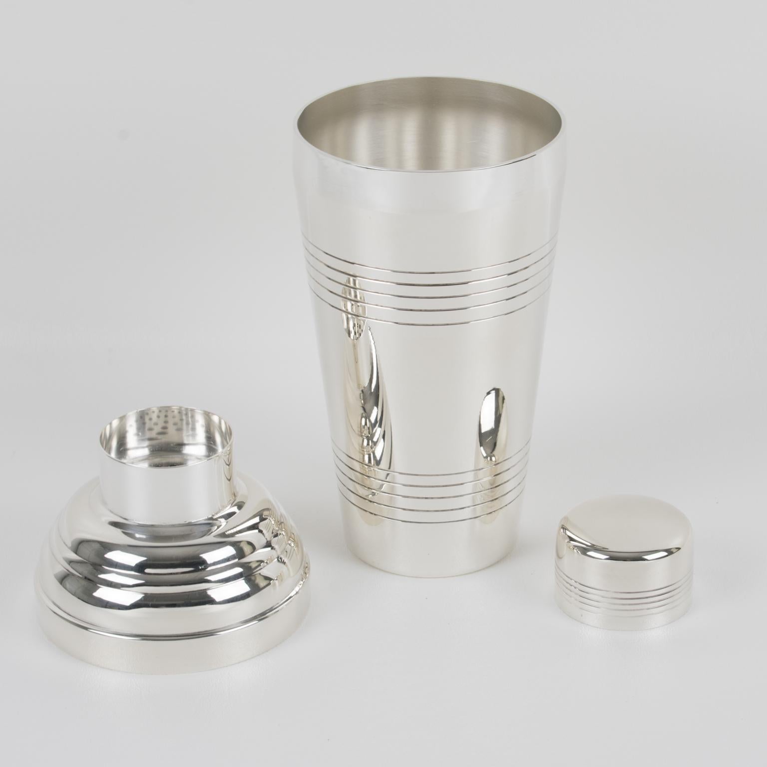 Elegant French Art Deco silver plate cylindrical cocktail or Martini shaker by silversmith Gelb, Paris. Three-sectioned designed cocktail shaker with removable cap and strainer. Lovely geometric shape with typical Deco design. Marked underside with