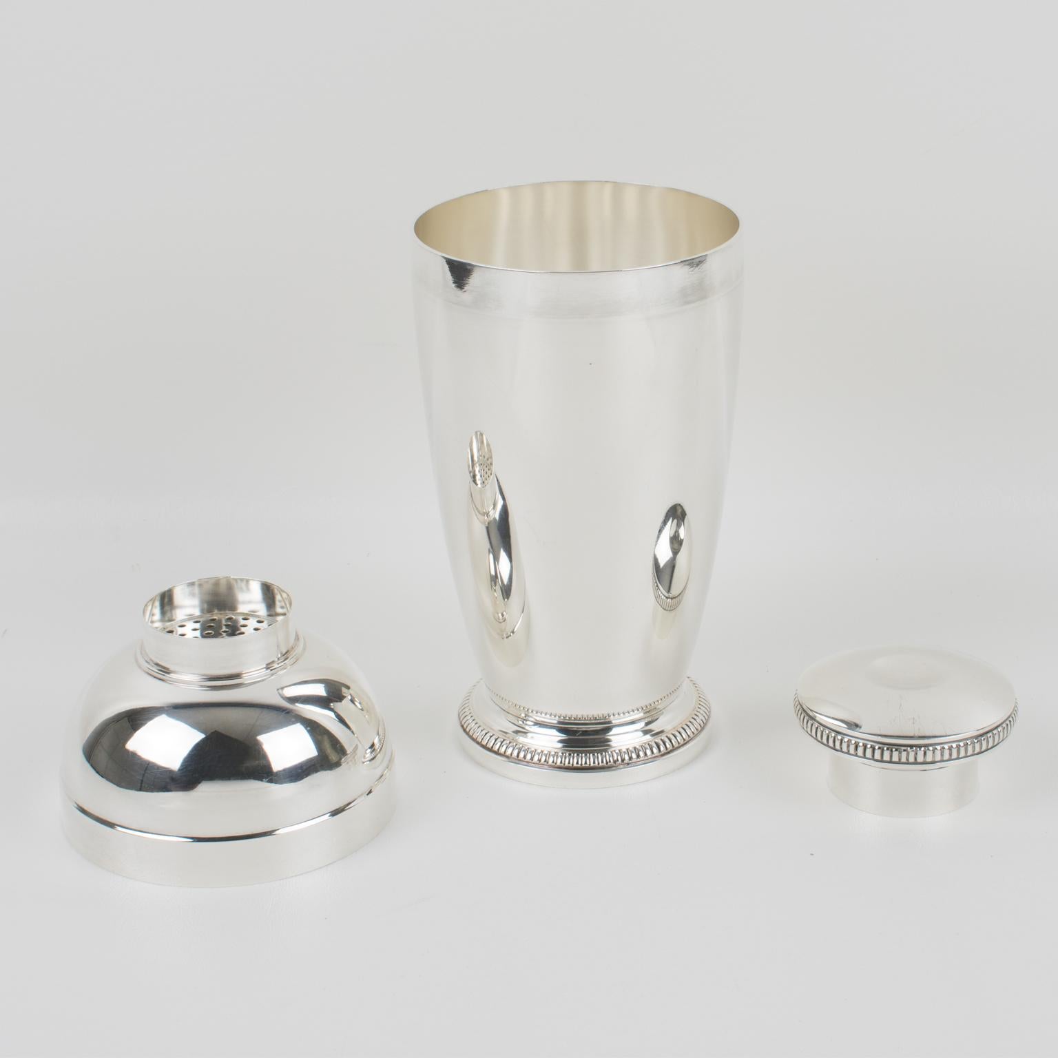 Elegant French Art Deco silver plate cylindrical cocktail or Martini shaker by silversmith Saint Medard, Paris. Three sectioned designed cocktail shaker with removable cap and strainer. Lovely Art Deco design with geometric bead beveling design