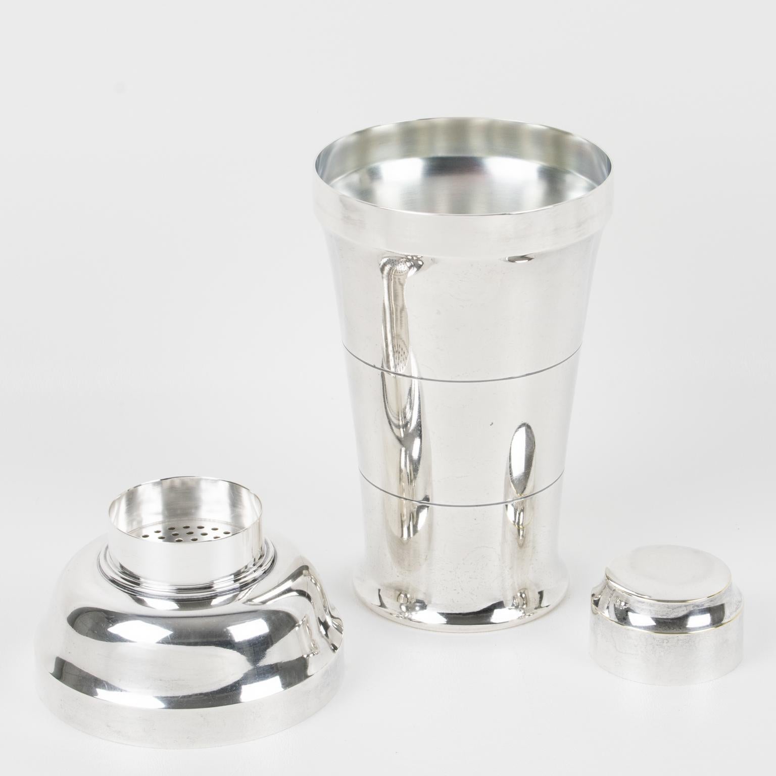 Elegant French Art Deco silver plate cylindrical cocktail or Martini shaker by silversmith Saint Medard, Paris. Three-sectioned designed cocktail shaker with removable cap and strainer. Lovely geometric shape with typical Deco design. Marked
