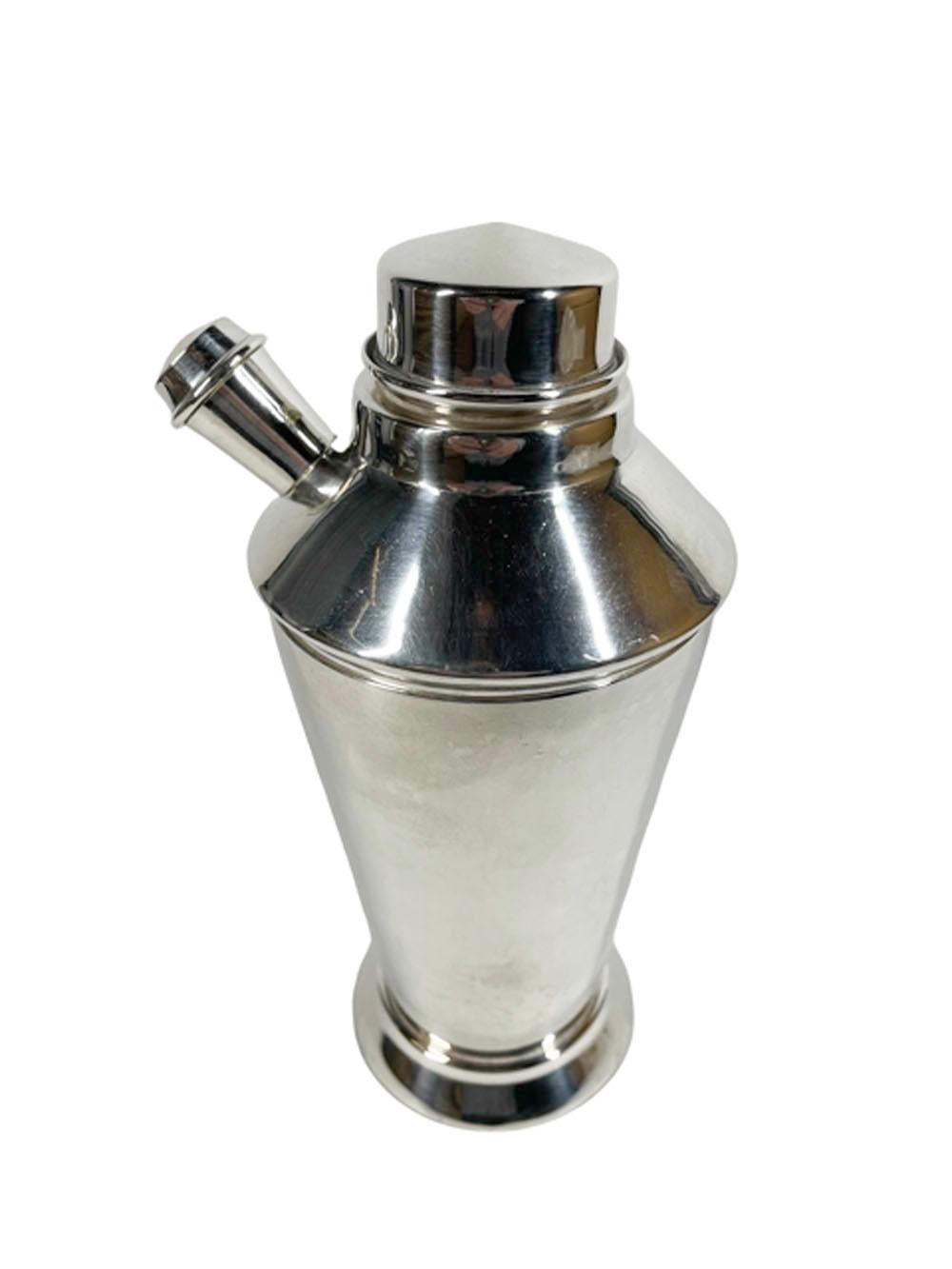 Finely crafted Art Deco silver plate cocktail shaker of angular form and having a lid with a center pour with an integral strainer as well as a side spout with screw cap.