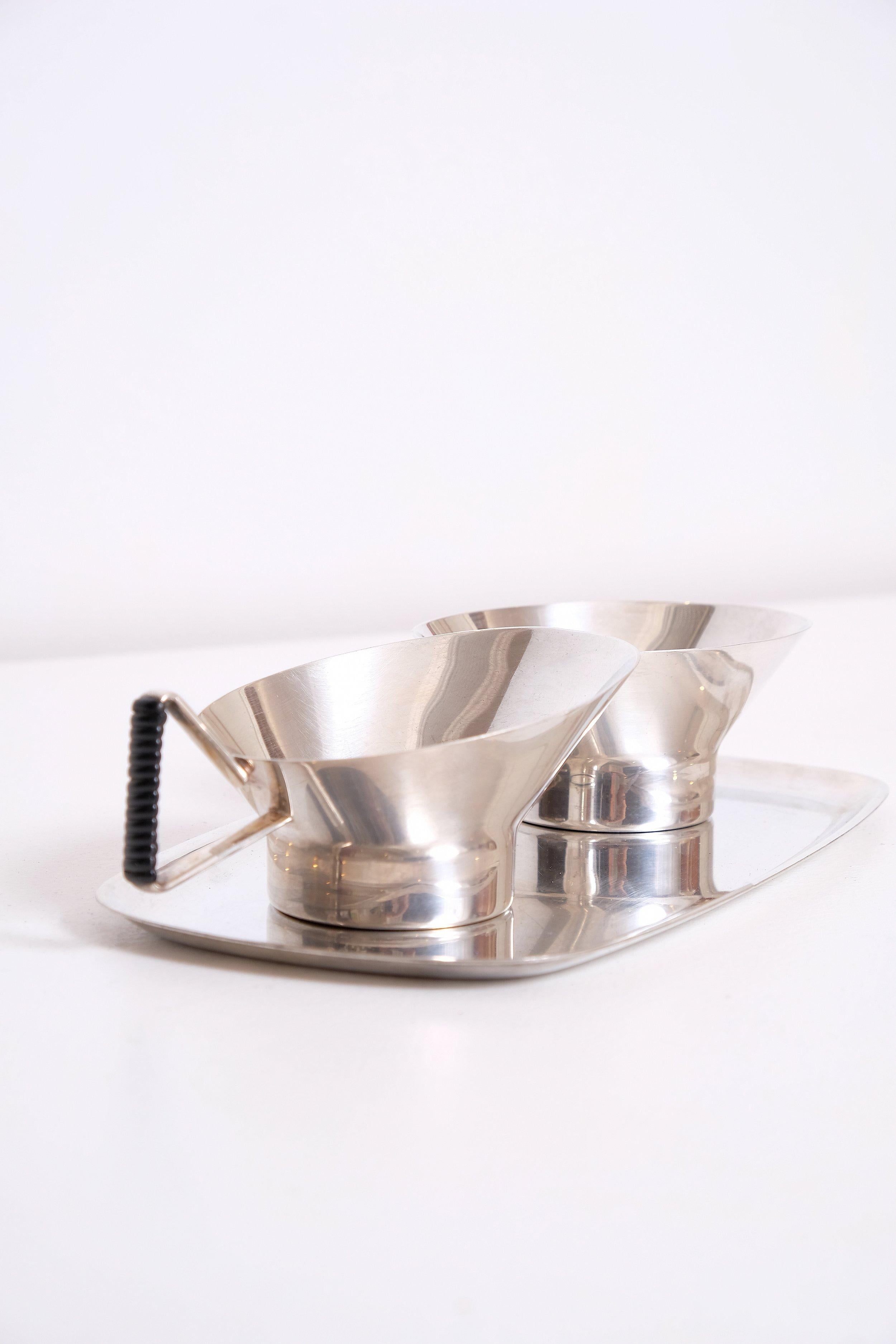 Elegant modernist silver plate Cream and sugar bowl and candy dish.

Light surface scratches throughout.

Creamer: 5” long x 3” wide x 2.5 ”high, Sugar: 4” long x 3” wide x 2.5 ”high, Tray 8” x 4.25”, Candy: 6” high x 5” wide