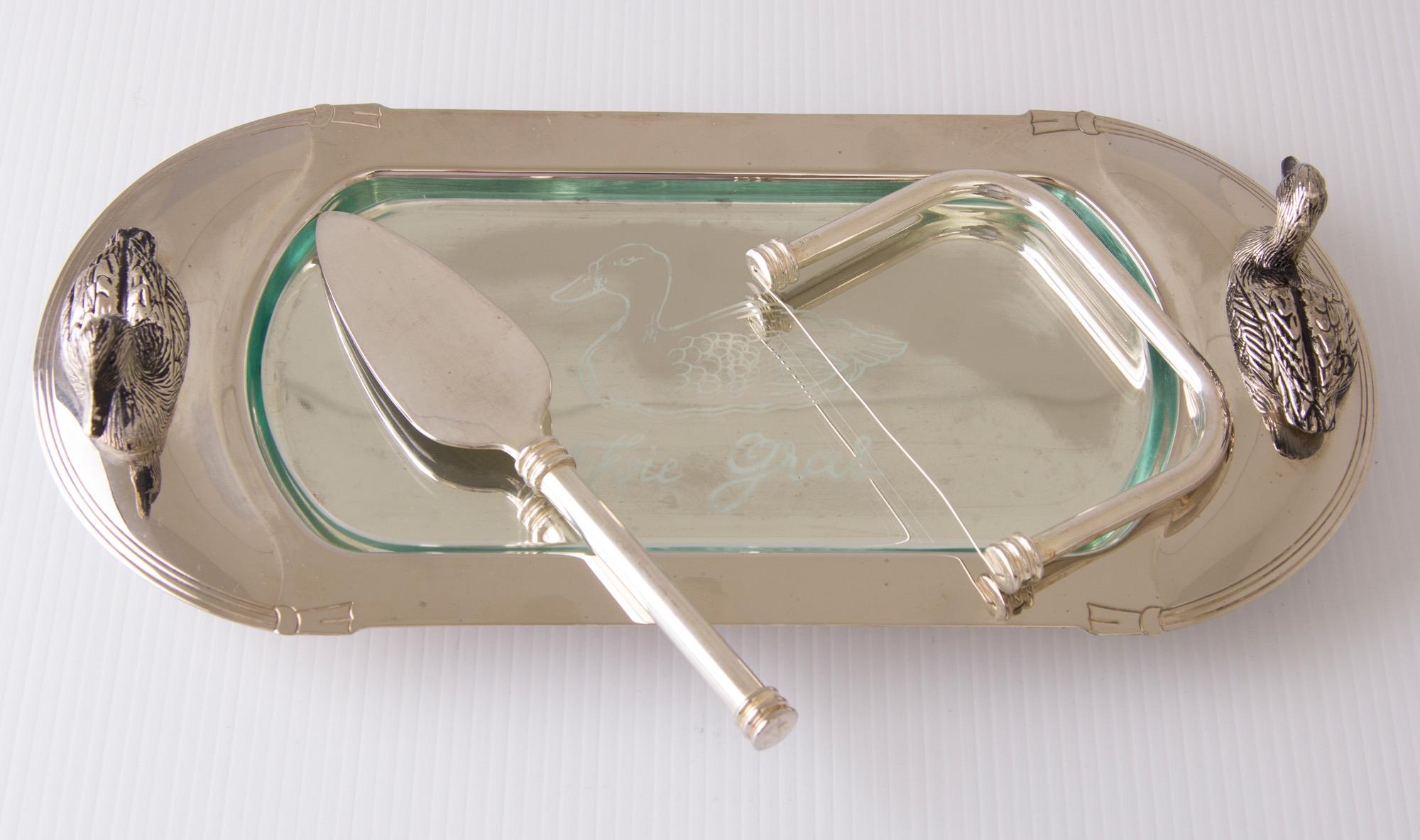 Art Deco swan design silver plate foie grass dish with glass liner, cutter and server.
Measures: H 7 cm, W 31 cm, D 15 cm.
French, circa 1930.