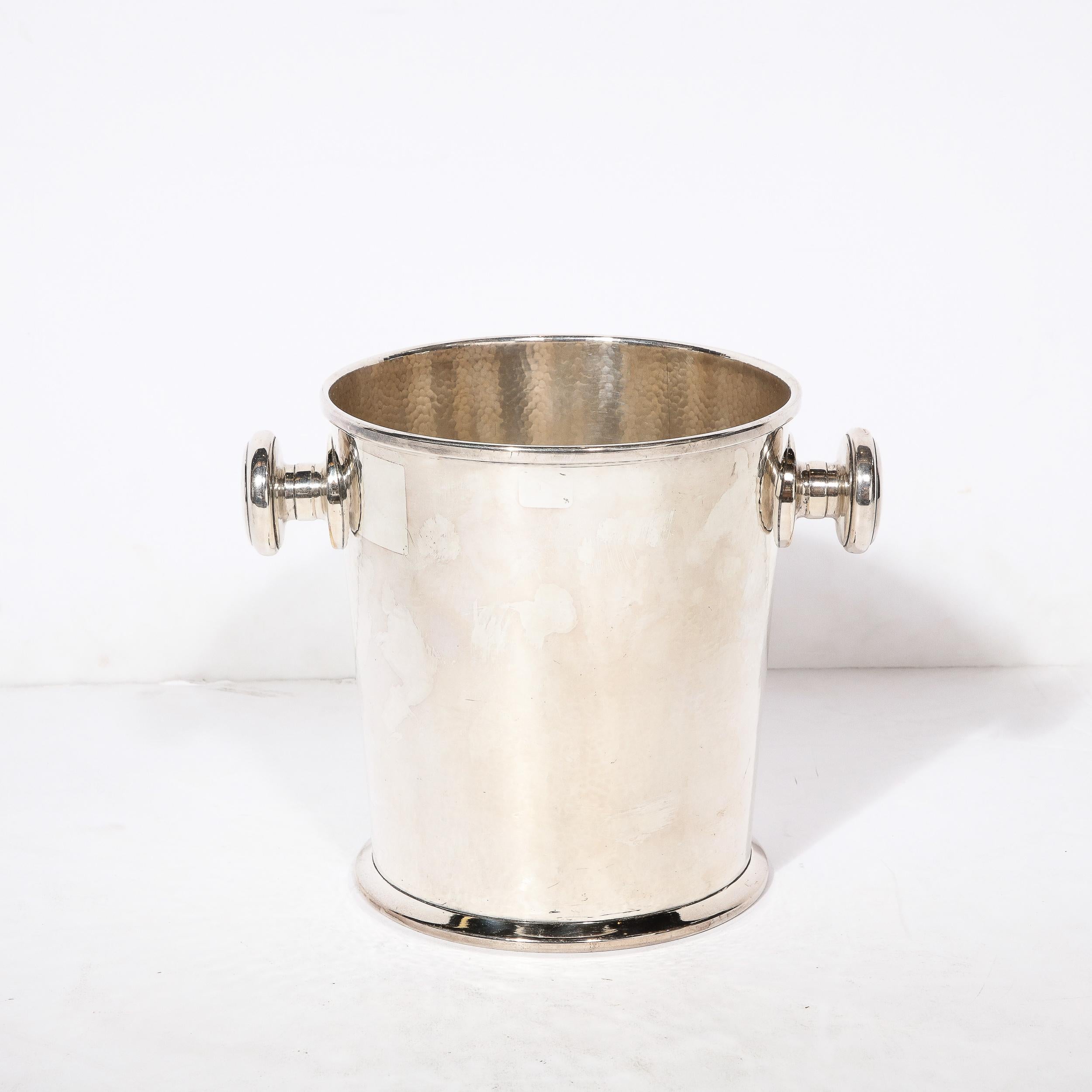 This beautifully bold Art Deco Silver Plate Ice Bucket with Rounded Handles and Hammered Textural Detailing originates from France, Circa 1930. The body has extremely precise hammered detailing creating a texture full of movement, evenly altering