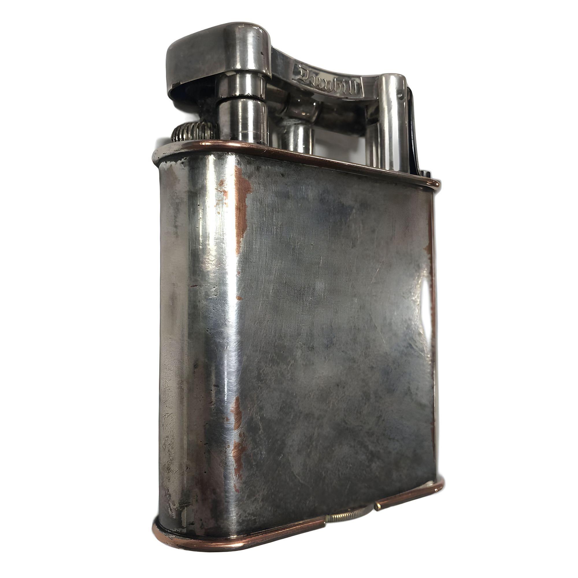 Original early 1930s silver plate tabletop lighter features a classic lift arm design Made by one of the most regarded lighter companies in the world Dunhill. This large tabletop lighter is in working order and is sure to add class to any