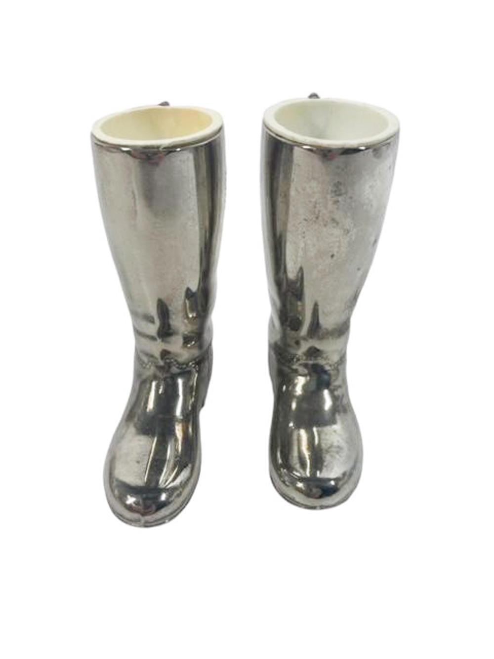 Pair of English Art Deco silver plate Spirit Measures / Jiggers in the form of boots with molded plastic liners of different capacities. 