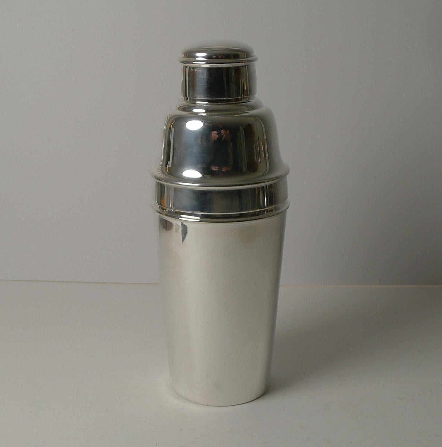 A handsome 1 pint cocktail shaker in silver plate by the top-notch silversmith, Mappin & Webb of London and Sheffield. This one is lucky enough to have an integral ice breaker inside the top portion, always highly desirable and sought-after.

The