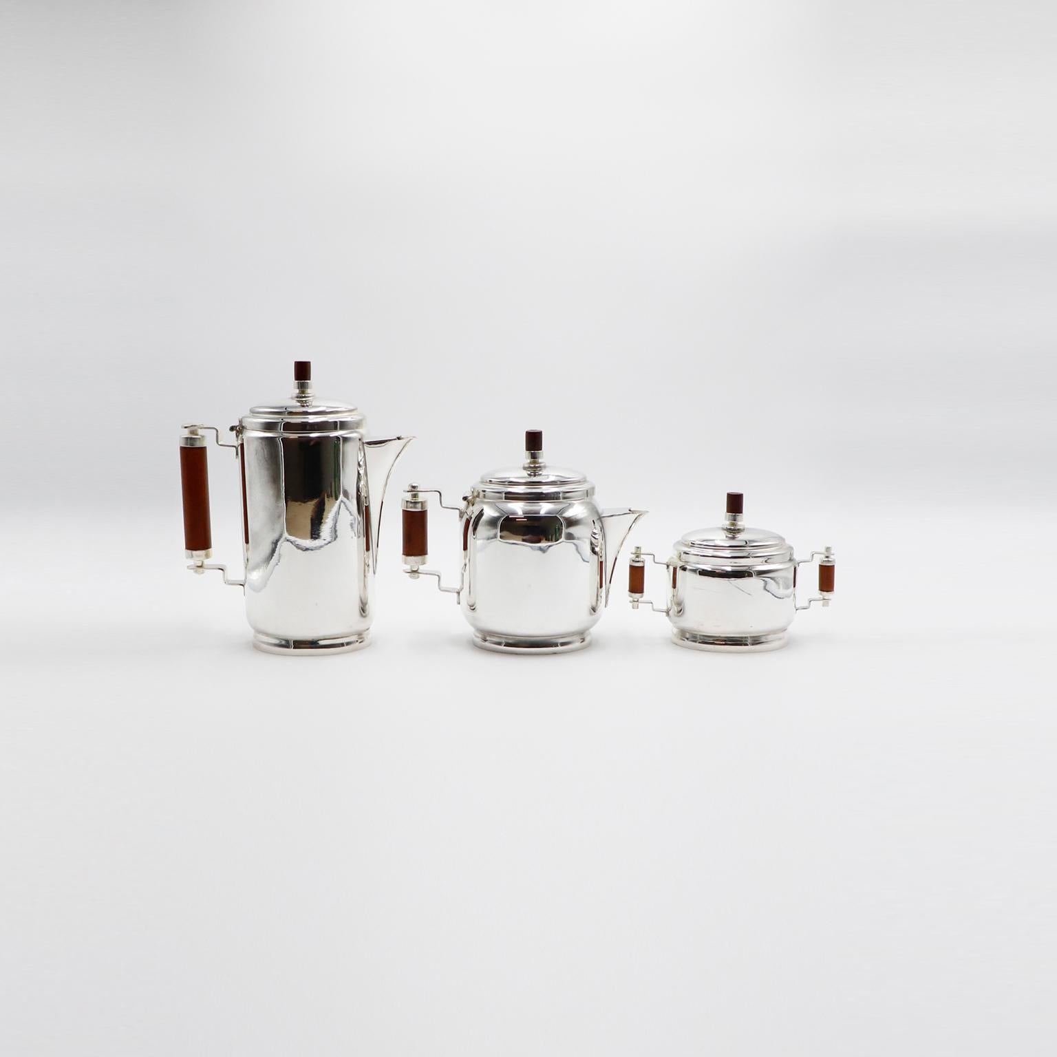 Circa 1960, we offer this Silver plated Art Deco Coffee Set.
1. Height: 23.5 cm. Width: 14.5 cm. Depth: 8 cm.
2. Height: 17.5 cm. Width: 20 cm. Depth: 10 cm.
3. Height: 13 cm. Width: 18 cm. Depth: 8.5 cm.