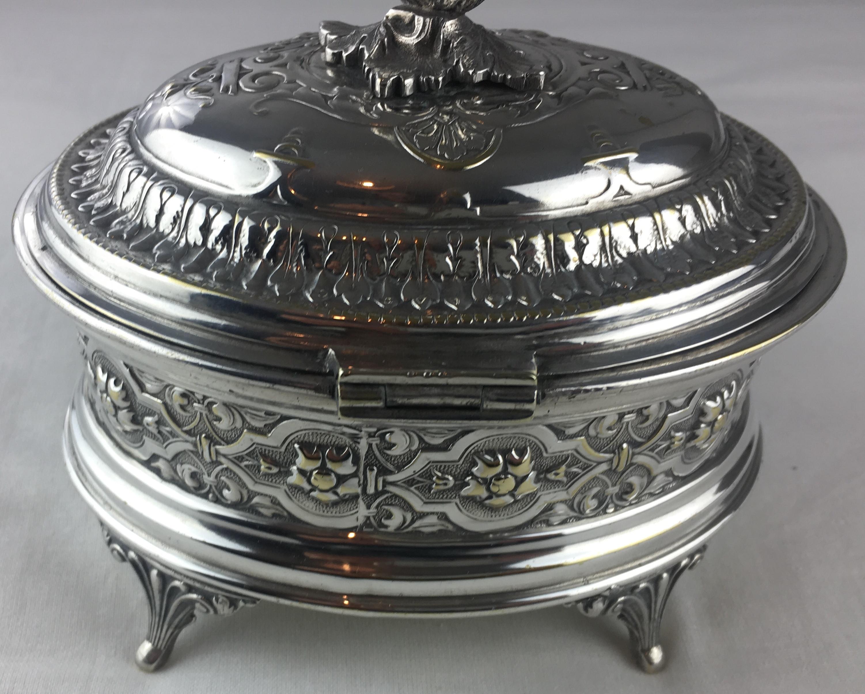 An intricately designed, handcrafted silver plated jewelry box, circa 1930s. 

A lovely footed piece in very good condition, bears the makers mark. 

Makes a great gift. 

  