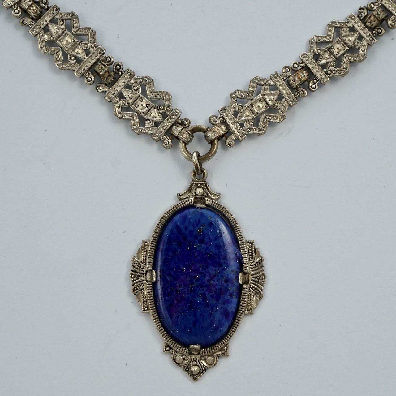 Art Deco ornate silver plated link chain sautoir necklace featuring a beautiful lapis lazuli pendant. The lapis lazuli is really lovely, embedded with sparkling fool's gold (iron pyrite). Length 42.6cm / 16.8 inches by width 9.5mm / .37 inch, and