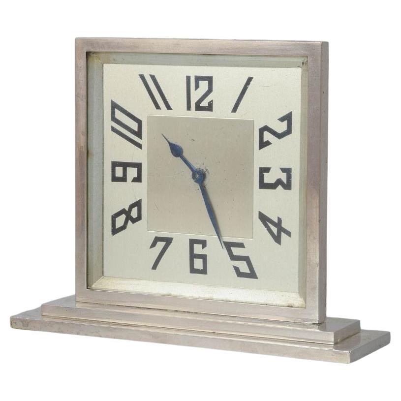Art Deco silver-plated mantel clock on a rectangular base. Sweden, 1930s For Sale