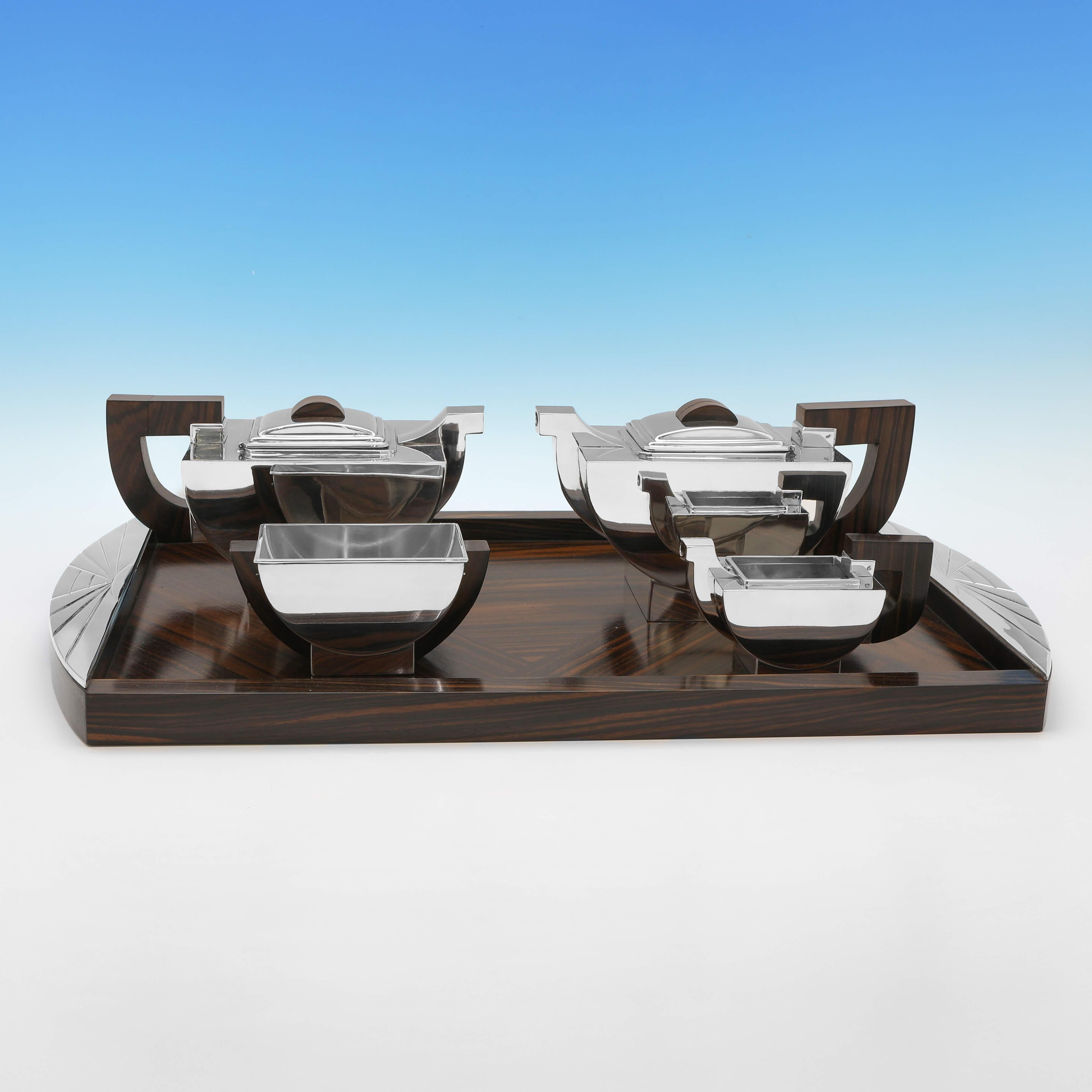 Made circa 1930, this very stylish, silver plated tea set on tray, is in the Art Deco taste, and features rosewood handles and tray base. 

The tray measures 1