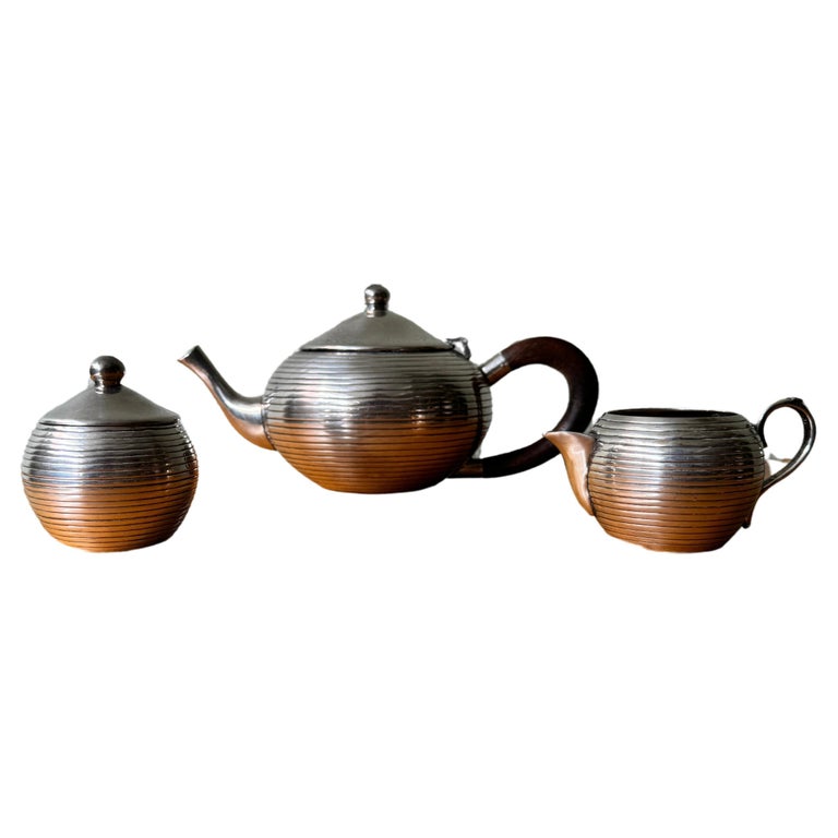 https://a.1stdibscdn.com/art-deco-silver-plated-tea-set-portugal-1930s-for-sale/f_67192/f_377673021704277555820/f_37767302_1704277556592_bg_processed.jpg?width=768